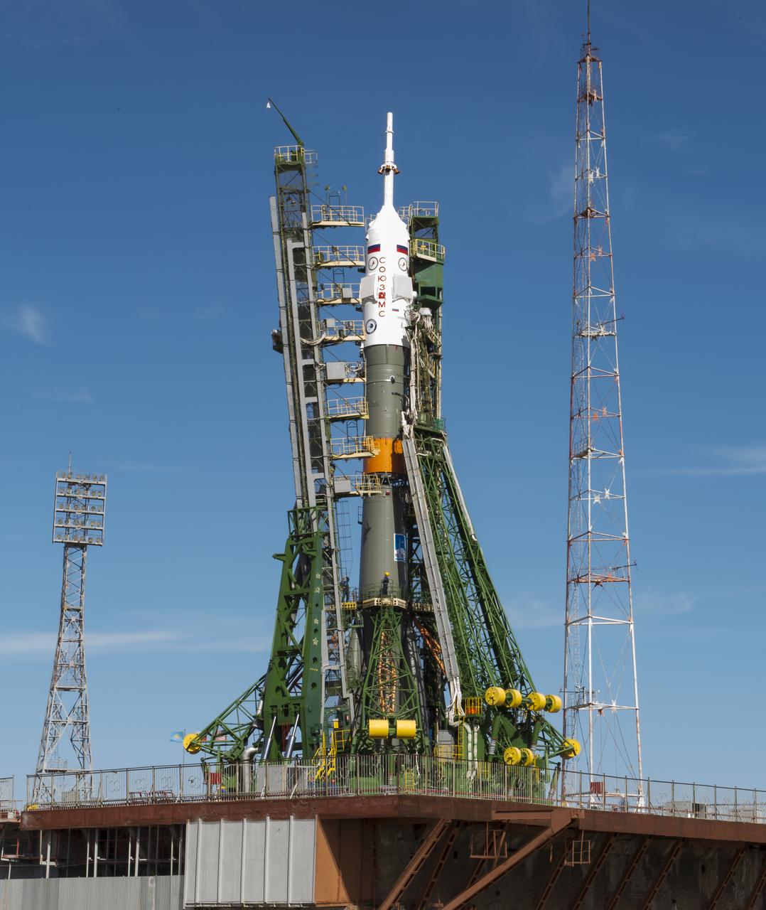 The gantry arms close around the Soyuz MS-04 spacecraft to secure the rocket at the launch pad on Monday, April 17, 2017 at the Baikonur Cosmodrome in Kazakhstan. Launch of the Soyuz rocket is scheduled for April 20 Baikonur time and will carry Expedition 51 Soyuz Commander Fyodor Yurchikhin of Roscosmos and Flight Engineer Jack Fischer of NASA into orbit to begin their four and a half month mission on the International Space Station. Photo Credit: (NASA/Aubrey Gemignani)