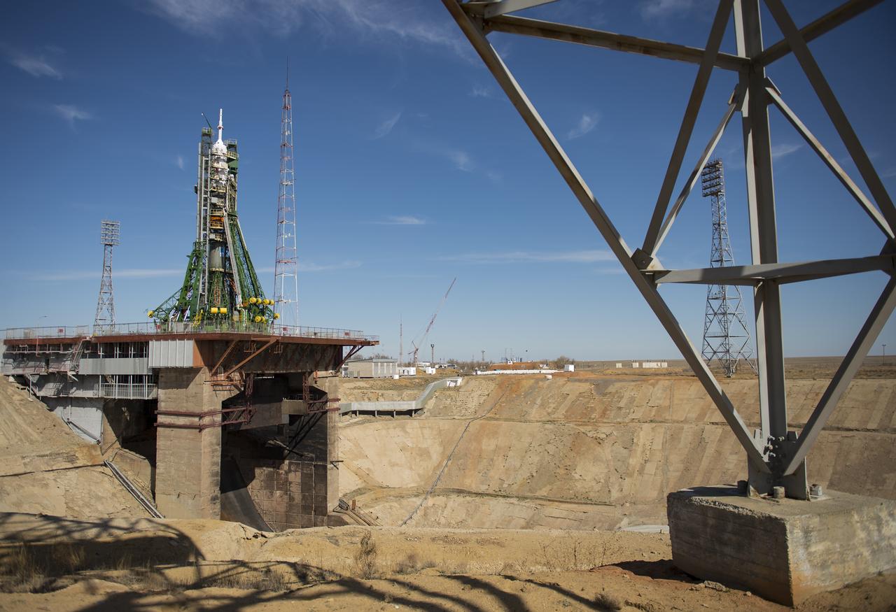 The Soyuz MS-04 spacecraft is seen after the gantry arms closed around the rocket to secure it at the launch pad on Monday, April 17, 2017 at the Baikonur Cosmodrome in Kazakhstan. Launch of the Soyuz rocket is scheduled for April 20 Baikonur time and will carry Expedition 51 Soyuz Commander Fyodor Yurchikhin of Roscosmos and Flight Engineer Jack Fischer of NASA into orbit to begin their four and a half month mission on the International Space Station. Photo Credit: (NASA/Aubrey Gemignani)