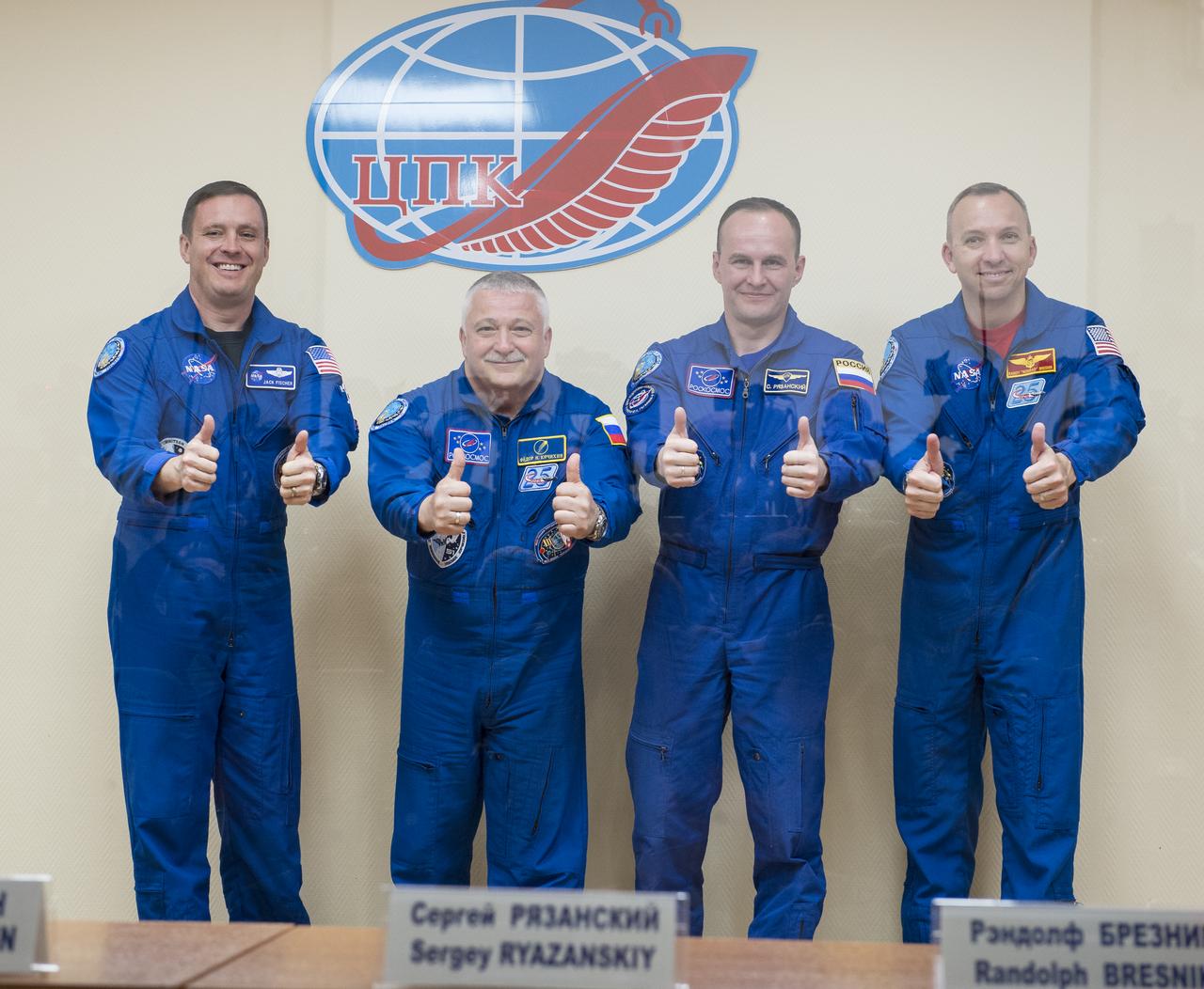 Expedition 51 prime crew members, Flight Engineer Jack Fischer of NASA, left, and Soyuz Commander Fyodor Yurchikhin of Roscosmos, second from left, pose for a photo with Expedition 51 back up crew members, Soyuz Commander Sergey Ryazanskiy of Roscosmos, second from right, and Flight Engineer Randy Bresnik of NASA, right, at the conclusion of the press conference held at the Cosmonaut Hotel in Baikonur, Kazakhstan on Wednesday, April 19, 2017. The mission is set to launch April 20 from the Baikonur Cosmodrome. Photo Credit: (NASA/Aubrey Gemignani)