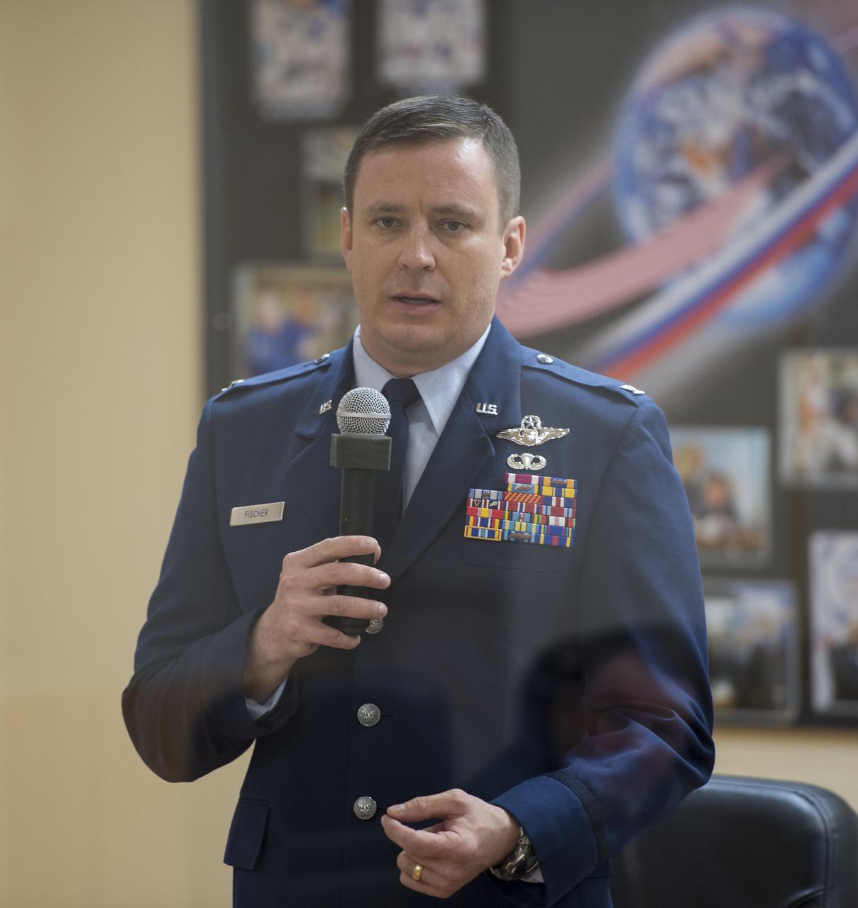 Expedition 51 Flight Engineer Jack Fischer speaks from behind glass, while in quarantine, during the State Commission meeting to approve the Soyuz launch of Expedition 51 to the International Space Station, Wednesday, April 19, 2017, at the Cosmonaut Hotel in Baikonur, Kazakhstan. Launch of the Soyuz rocket is scheduled for April 20 and will carry Fischer and Soyuz Commander Fyodor Yurchikhin of Roscosmos into orbit to begin their four and a half month mission on the International Space Station. Photo Credit: (NASA/Aubrey Gemignani)