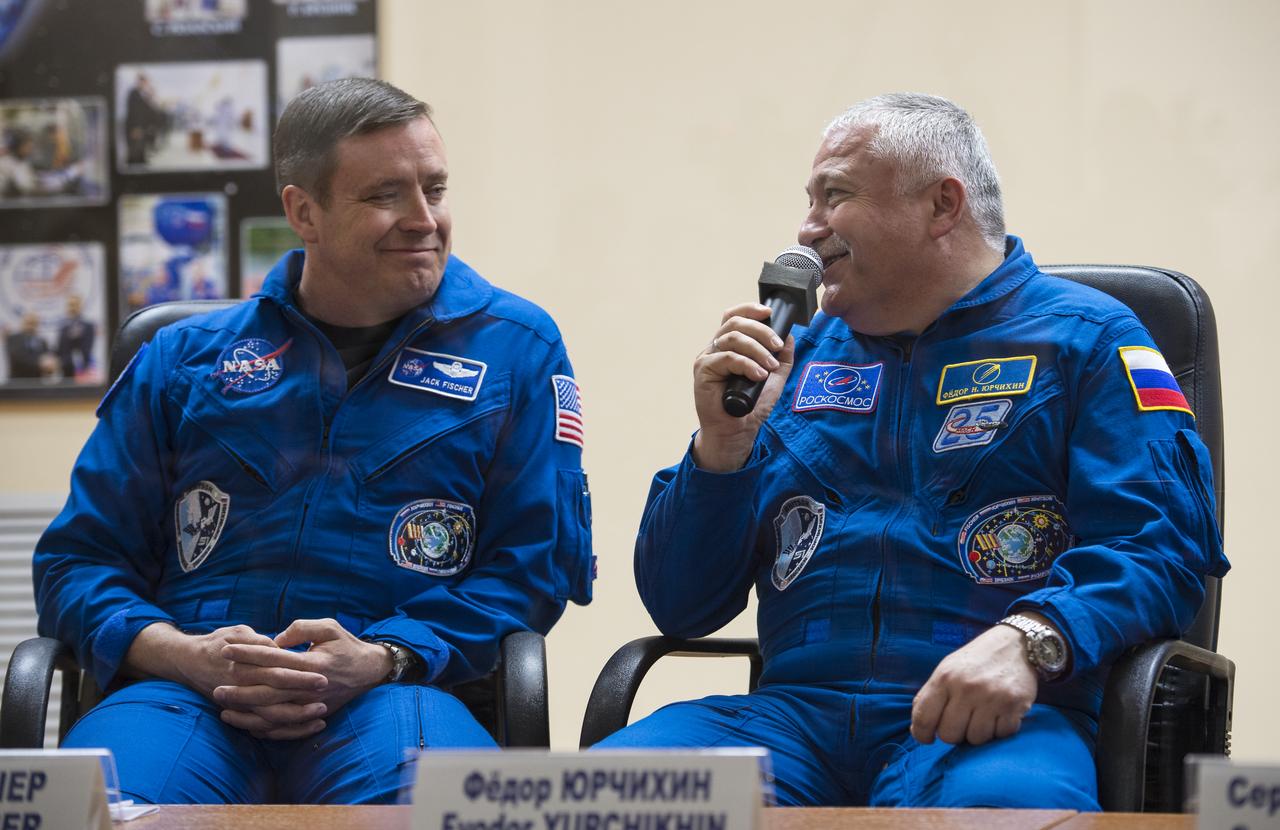 Expedition 51 Soyuz Commander Fyodor Yurchikhin of Roscosmos, right, answers a question during a press conference on Wednesday, April 19, 2017 at the Cosmonaut Hotel in Baikonur, Kazakhstan. He is seen with fellow crewmate Flight Engineer Jack Fischer of NASA. Launch of the Soyuz rocket is scheduled for April 20 and will carry Yurchikhin and Fischer into orbit to begin their four and a half month mission on the International Space Station. Photo Credit: (NASA/Aubrey Gemignani).