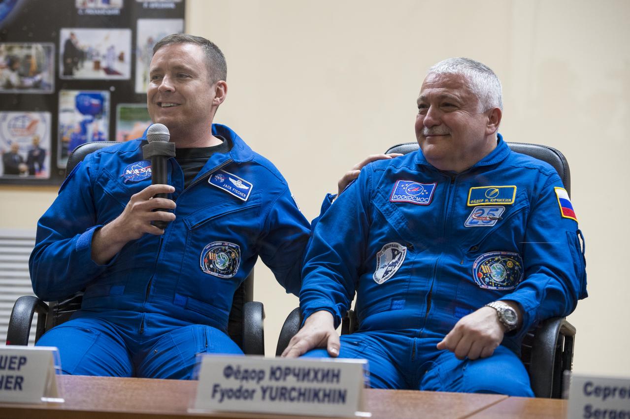 Expedition 51 Flight Engineer Jack Fischer of NASA, left, answers a question with Soyuz Commander Fyodor Yurchikhin of Roscosmos, right, during a press conference on Wednesday, April 19, 2017 at the Cosmonaut Hotel in Baikonur, Kazakhstan. Launch of the Soyuz rocket is scheduled for April 20 and will carry Yurchikhin and Fischer into orbit to begin their four and a half month mission on the International Space Station. Photo Credit: (NASA/Aubrey Gemignani)