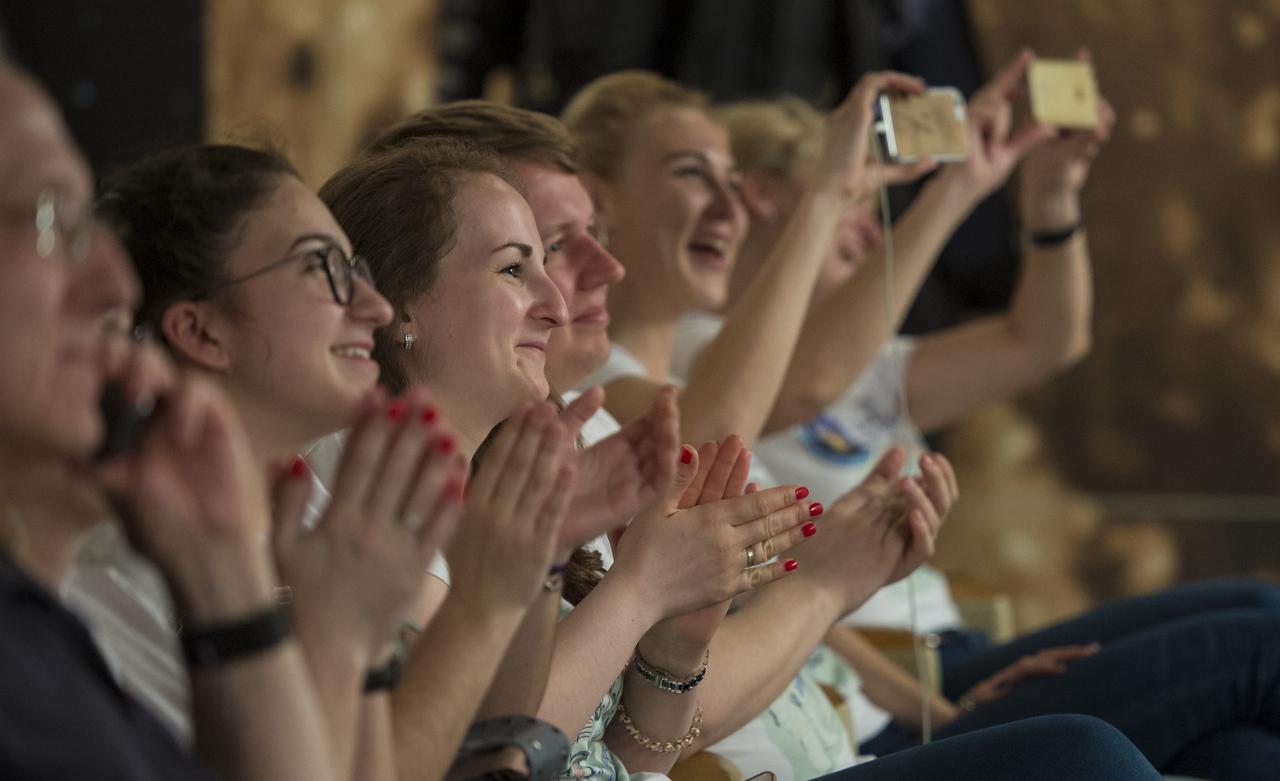 Family and friends of Expedition 51 Soyuz Commander Fyodor Yurchikhin of Roscosmos reacts as they see Yurchikhin enter the International Space Station during a live video feed of the Expedition 51 crew members a few hours after the Soyuz MS-04 spacecraft docked on Thursday, April 20, 2017 at Tsenki Conference Hall in Baikonur, Kazakhstan. Flight engineer Jack Fischer of NASA and Yurchikhin's arrival to the International Space Station comes the same day they launched from the Baikonur Cosmodrome in Kazakhstan. Photo Credit (NASA/Aubrey Gemignani)