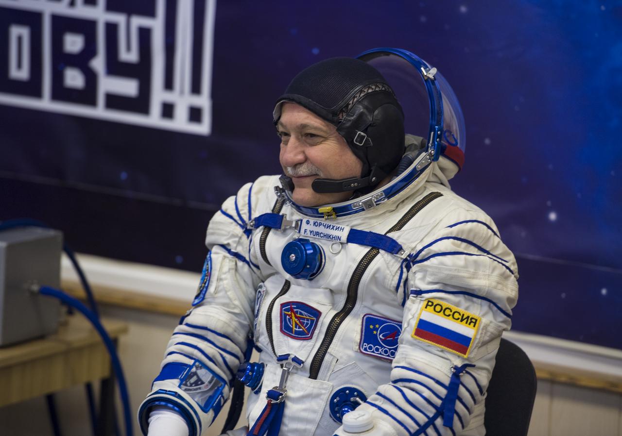 Expedition 51 Soyuz Commander Fyodor Yurchikhin of Roscosmos smiles at friends and family after having his Russian Sokol suit pressure checked in preparation for launch aboard the Soyuz MS-04 spacecraft on Thursday, April 20, 2017 at the Baikonur Cosmodrome in Kazakhstan. Launch of the Soyuz rocket is scheduled for 1:13pm April 20 Baikonur time, and will Yurchikhin and crewmate Flight Engineer Jack Fischer of NASA into orbit to begin their four and a half month mission on the International Space Station. Photo Credit: (NASA/Aubrey Gemignani)