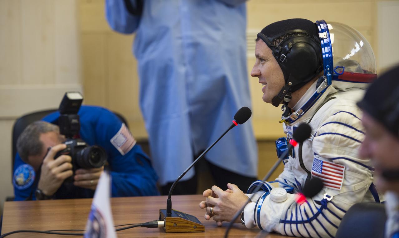 Expedition 51 Flight Engineer Jack Fischer of NASA speaks with his family after having his Russian Sokol suit pressure checked in preparation for launch onboard the Soyuz MS-04 spacecraft on Thursday, April 20, 2017 at the Baikonur Cosmodrome in Kazakhstan. The Soyuz spacecraft with Fischer and Soyuz Commander Fyodor Yurchikhin of Roscosmos is scheduled to launch at 1:13pm Baikonur time on April 20. Photo Credit: (NASA/Aubrey Gemignani)
