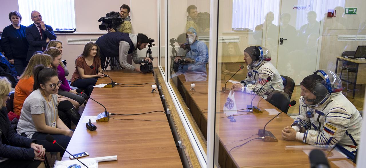 Expedition 51 Flight Engineer Jack Fischer of NASA, top right, and Soyuz Commander Fyodor Yurchikhin of Roscosmos, bottom right, speak with family after having their Russian Sokol suits pressure checked in preparation for launch onboard the Soyuz MS-04 spacecraft on Thursday, April 20, 2017 at the Baikonur Cosmodrome in Kazakhstan. The Soyuz spacecraft with Fischer and Yurchikhin is scheduled to launch at 1:13pm Baikonur time on April 20. Photo Credit: (NASA/Aubrey Gemignani)