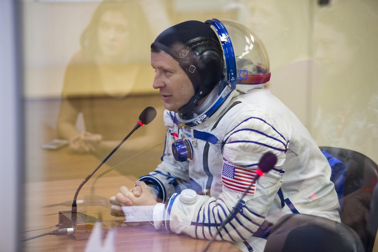 Expedition 51 Flight Engineer Jack Fischer of NASA speaks with his family after having his Russian Sokol suit pressure checked in preparation for launch onboard the Soyuz MS-04 spacecraft on Thursday, April 20, 2017 at the Baikonur Cosmodrome in Kazakhstan. The Soyuz spacecraft with Fischer and Soyuz Commander Fyodor Yurchikhin of Roscosmos is scheduled to launch at 1:13pm Baikonur time on April 20. Photo Credit: (NASA/Aubrey Gemignani)