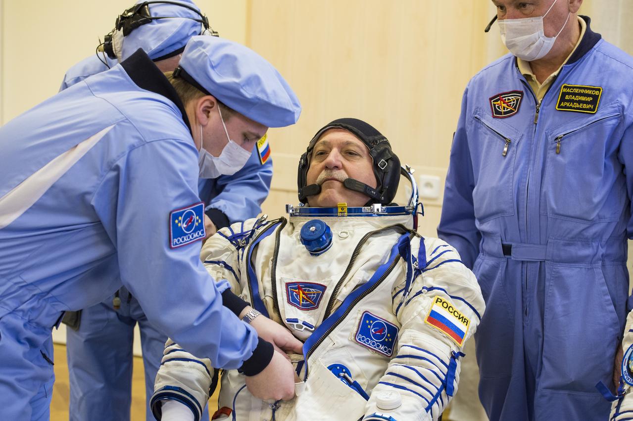 Expedition 51 Soyuz Commander Fyodor Yurchikhin of Roscosmos is helped into his Russian Sokol suit as he and fellow crewmate Flight Engineer Jack Fischer of NASA prepare for their Soyuz launch to the International Space Station, on Thursday, April 20, 2017 at the Baikonur Cosmodrome in Kazakhstan. Launch of the Soyuz rocket is scheduled for 1:13 p.m. April 20 Baikonur time, and will carry Yurchikhin and Fischer into orbit to begin their four and a half month mission on the International Space Station. Photo Credit: (GCTC/Andrey Shelepin)