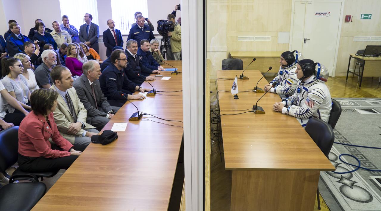 Expedition 51 Flight Engineer Jack Fischer of NASA, bottom right, and Soyuz Commander Fyodor Yurchikhin of Roscosmos, top right, speak with leadership of Roscosmos and NASA after having their Russian Sokol suits pressure checked in preparation for launch onboard the Soyuz MS-04 spacecraft on Thursday, April 20, 2017 at the Baikonur Cosmodrome in Kazakhstan. The Soyuz spacecraft with Fischer and Yurchikhin is scheduled to launch at 1:13pm Baikonur time on April 20. Photo Credit: (NASA/Victor Zelentsov)