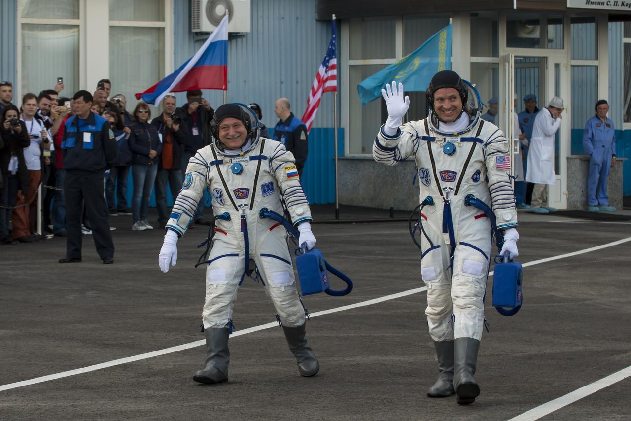 Expedition 51 Soyuz Commander Fyodor Yurchikhin of Roscosmos, left, and Flight Engineer Jack Fischer of NASA, right, are seen as they depart building 254 a few hours ahead of their launch, Thursday, April 20, 2017, in Baikonur, Kazakhstan. Yurchikhin and Fischer launched in their Soyuz MS-04 spacecraft to the International Space Station to begin a four and a half month mission. Photo Credit: (NASA/Victor Zelentsov)