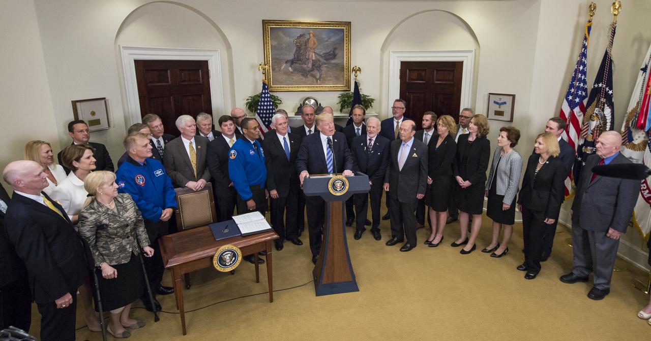 President Donald Trump, center, speaks before signing an Executive Order to reestablish the National Space Council, alongside members of the Congress, National Aeronautics and Space Administration, and Commercial Space Companies in the Roosevelt room of the White House in Washington, Friday, June 30, 2017. Vice President Mike Pence, also in attendance, will chair the council. Also pictured are, Rep. Bill Posey, R-Florida, Rep. Lamar Smith, R-Texas, Rep. John Culberson, R-Texas, Rep. Steven Palazzo, R-Miss., Rep. Brian Babin, R-Texas, Rep. Mo Brooks, R-Alabama, Rep. Dana Rohrbacher, R-California, Former Rep. Bob Walker, R-Pennsylvania, Sandy Magnus, executive director, American Institute of Aeronautics and Astronautics, David Melcher, executive director, Aerospace Industries Association, Tory Bruno, CEO, United Launch Alliance, Michal Riley, CEO, AMRO Fabricating Corporation, John Couch, president, Futuramic, Mike Cain, owner, Cain Tubular Products, Mary Lynne Dittmar, executive director, Coalition for Deep Space Exploration, Dennis Muilenburg, CEO Boeing Company, Marilyn Hewson, CEO, Lockheed Martin, Wes Bush, CEO, Northrop Grumman, retired NASA astronaut Buzz Aldrin, NASA astronaut Alvin Drew, retired NASA astronaut David Wolf, Apollo 13 flight director, Gene Kranz, Secretary of Commerce Wilbur Ross, Under Secretary of the Air Force Lisa Disbrow, and Acting Deputy Director of National Intelligence, Dawn Eilengerger. Photo Credit: (NASA/Aubrey Gemignani)