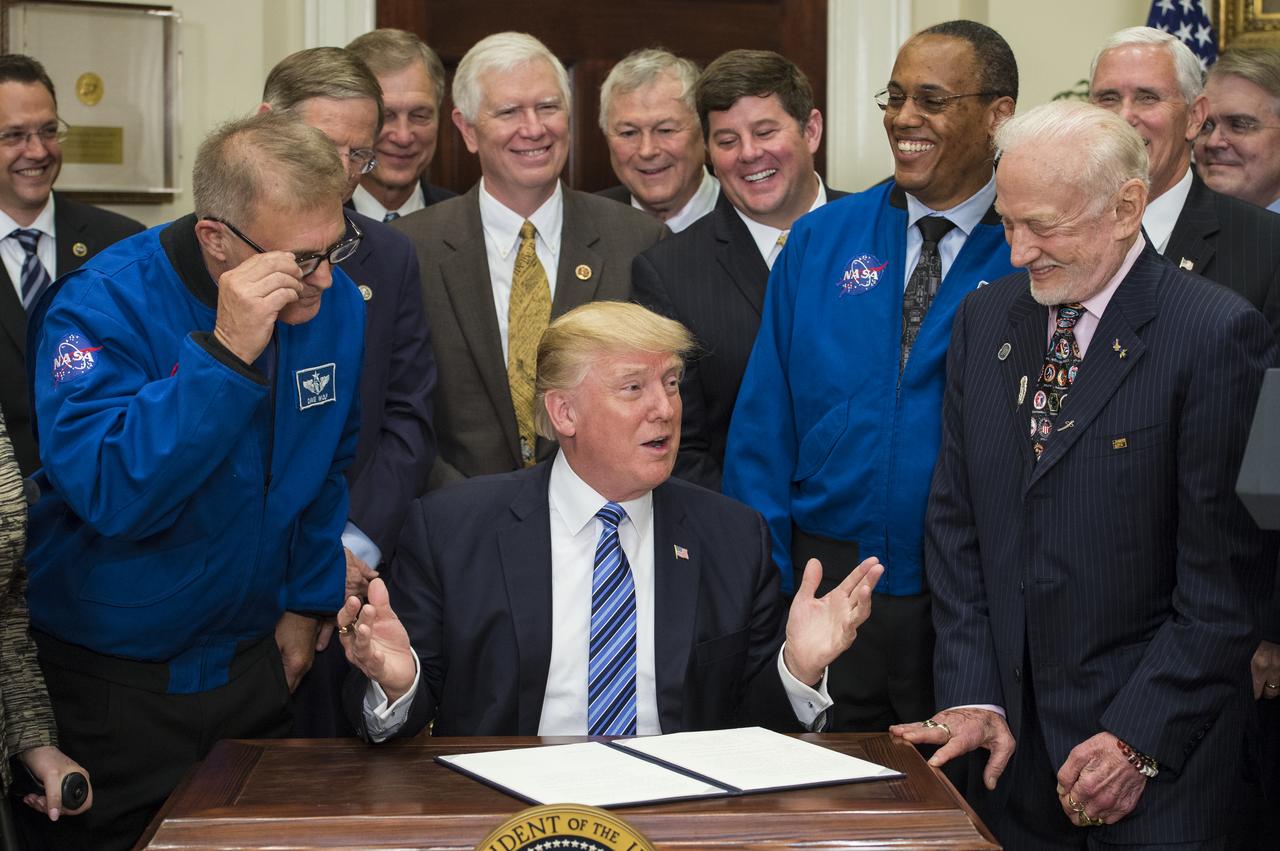 President Donald Trump, center, speaks to the crowd before signing an Executive Order to reestablish the National Space Council, alongside members of the Congress, National Aeronautics and Space Administration, and Commercial Space Companies in the Roosevelt room of the White House in Washington, Friday, June 30, 2017. Vice President Mike Pence, also in attendance, will chair the council. Also pictured are retired NASA astronaut David Wolf, left, NASA Astronaut Alvin Drew, second from right, and retired NASA astronaut Buzz Aldrin, right. Photo Credit: (NASA/Aubrey Gemignani)