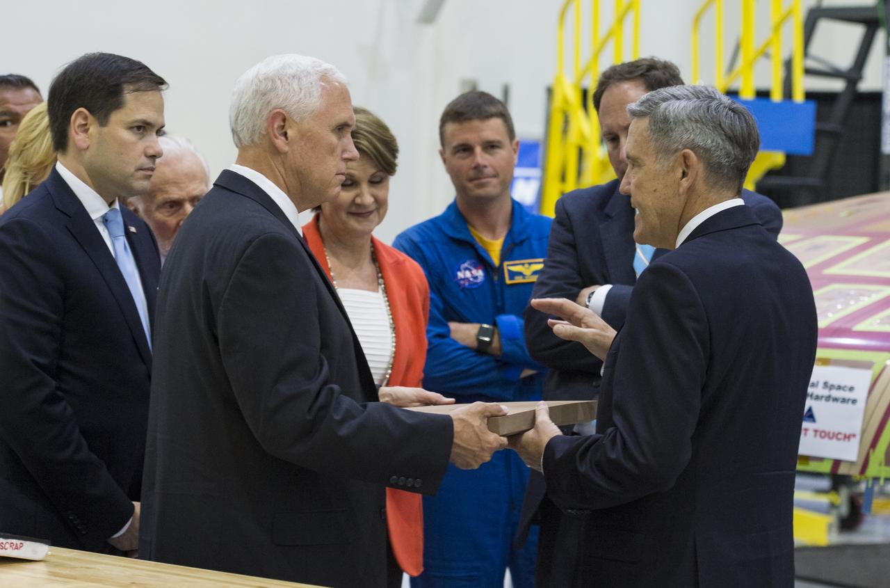 Vice President Mike Pence, left, looks at a component of Orion’s heat shield during a visit to the Operations and Checkout Building at Kennedy Space Center (KSC) on Thursday, July 6, 2017 in Cape Canaveral, Florida. Photo Credit: (NASA/Aubrey Gemignani)