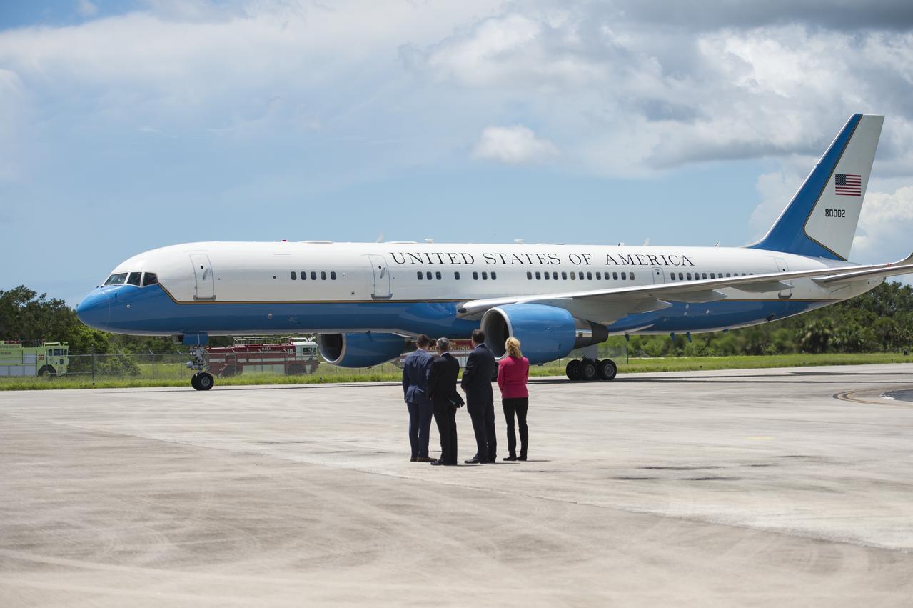 Vice President Mike Pence arrives in Air Force Two as NASA Leadership looks on, at the Shuttle Landing Facility (SLF) to highlight innovations made in America and tour some of the public/private partnership work that is helping to transform Kennedy Space Center (KSC) into a multi-user spaceport on Thursday, July 6, 2017 in Cape Canaveral, Florida. Photo Credit: (NASA/Aubrey Gemignani)