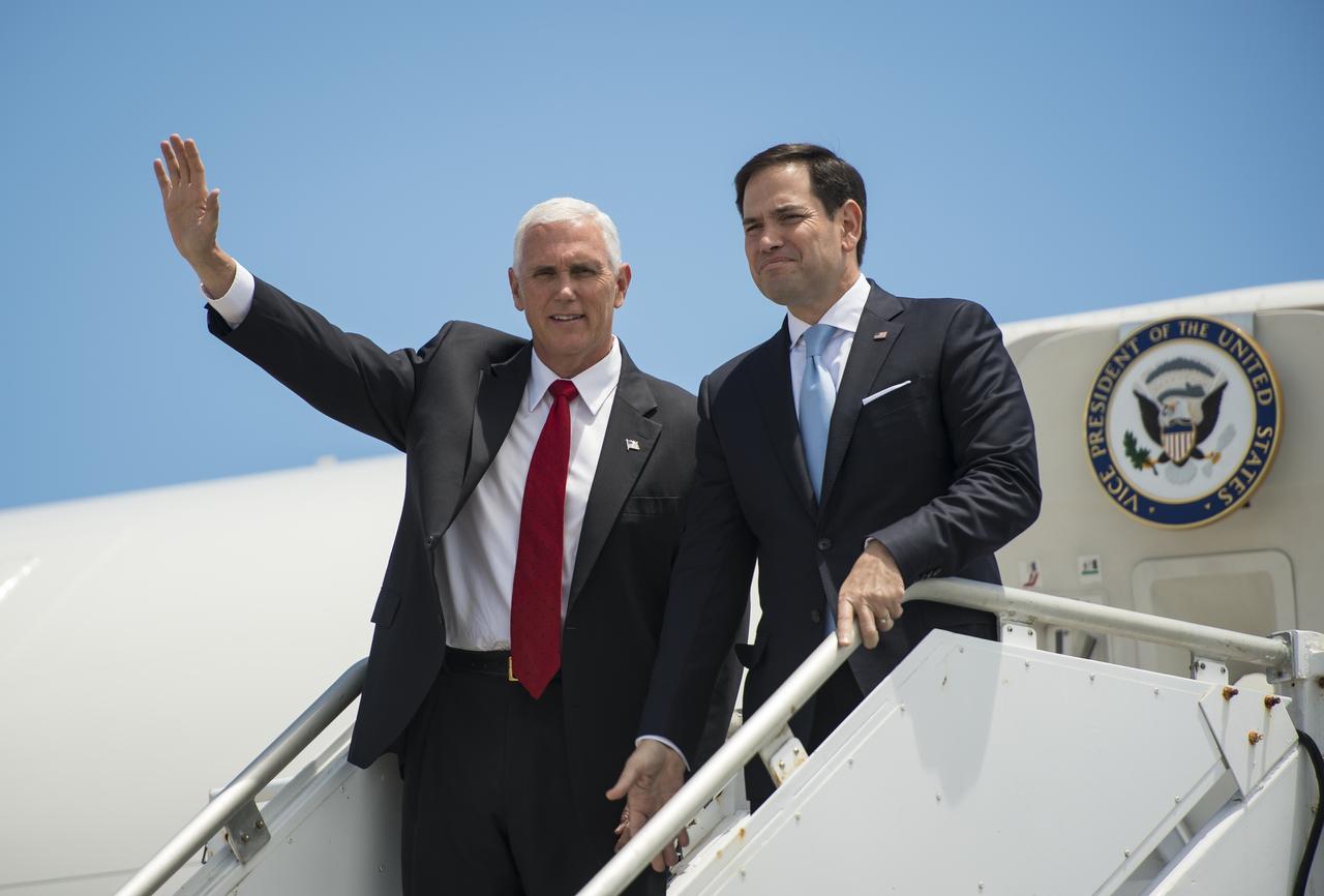 Vice President Mike Pence waves next to Sen. Marco Rubio, R-Fla., after they arrived on Air Force Two at the Shuttle Landing Facility (SLF) to highlight innovations made in America and tour some of the public/private partnership work that is helping to transform Kennedy Space Center (KSC) into a multi-user spaceport on Thursday, July 6, 2017 in Cape Canaveral, Florida. Photo Credit: (NASA/Aubrey Gemignani)