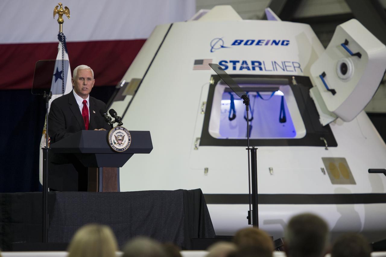 Vice President Mike Pence addresses NASA employees in front of a mockup of Boeing's Starliner capsule, Thursday, July 6, 2017, at the Vehicle Assembly Building at NASA’s Kennedy Space Center (KSC) in Cape Canaveral, Florida. The Vice President thanked employees for advancing American leadership in space, before going on a tour of the center that highlighted the public-private partnerships at KSC, as both NASA and commercial companies prepare to launch American astronauts from the multi-user spaceport. Photo Credit: (NASA/Aubrey Gemignani)