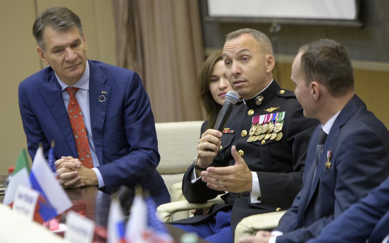 Expedition 52 flight engineer Randy Bresnik of NASA answers a reporter's question during a crew press conference at the Gagarin Cosmonaut Training Center (GCTC) as Expedition 52 flight engineers Paolo Nespoli of ESA, left, and Sergey Ryazanskiy of Roscosmos look on, Monday, July 10, 2017 in Star City, Russia.  Photo Credit: (NASA/Bill Ingalls)