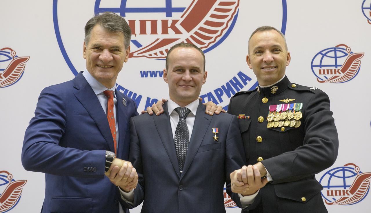 Expedition 52 flight engineers Paolo Nespoli of ESA, left, Sergey Ryazanskiy of Roscosmos, center, and Expedition 52 flight engineer Randy Bresnik of NASA pose for group photograph at the conclusion of their crew press conference at the Gagarin Cosmonaut Training Center (GCTC), Monday, July 10, 2017 in Star City, Russia.  Photo Credit: (NASA/Bill Ingalls)