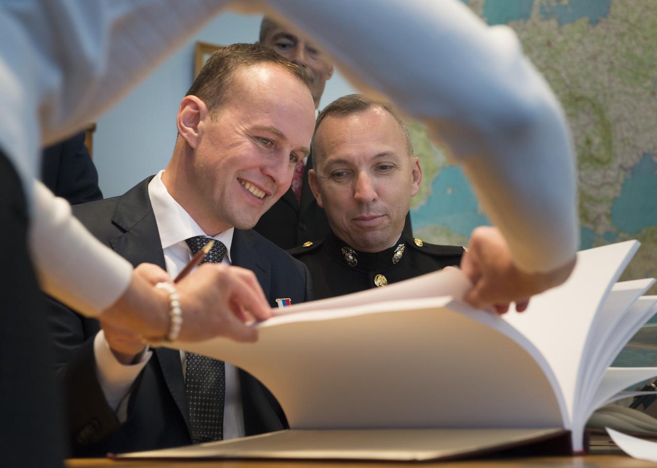 Expedition 52 flight engineers Sergey Ryazanskiy of Roscosmos, seated left, and Randy Bresnik of NASA are seen as they sign a guest book at the "Memorial working study of Yuri Gagarin" at the Gagarin Cosmonaut Training Center (GCTC), Monday, July 10, 2017 in Star City, Russia. The memorial study represents Gagarin's working study in the way it was abandoned by Gagarin on March 27, 1968 before leaving for the airfield for training flight that became his last. Photo Credit: (NASA/Bill Ingalls)