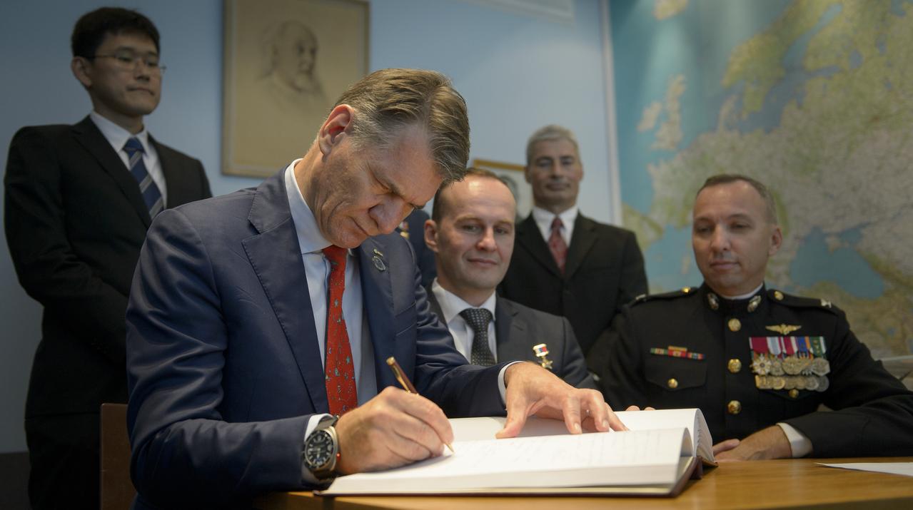 Expedition 52 flight engineers Paolo Nespoli of ESA, seated left, Sergey Ryazanskiy of Roscosmos, seated center, Randy Bresnik of NASA, seated right, joined by backup crew members, Norishige Kanai, standing left, Alexander Misurkin, not pictured, and Mark Vande Hei, right, are seen as they sign a guest book at the "Memorial working study of Yuri Gagarin" at the Gagarin Cosmonaut Training Center (GCTC), Monday, July 10, 2017 in Star City, Russia.  The memorial study represents Gagarin's working study in the way it was abandoned by Gagarin on March 27, 1968 before leaving for the airfield for training flight that became his last. Photo Credit: (NASA/Bill Ingalls)