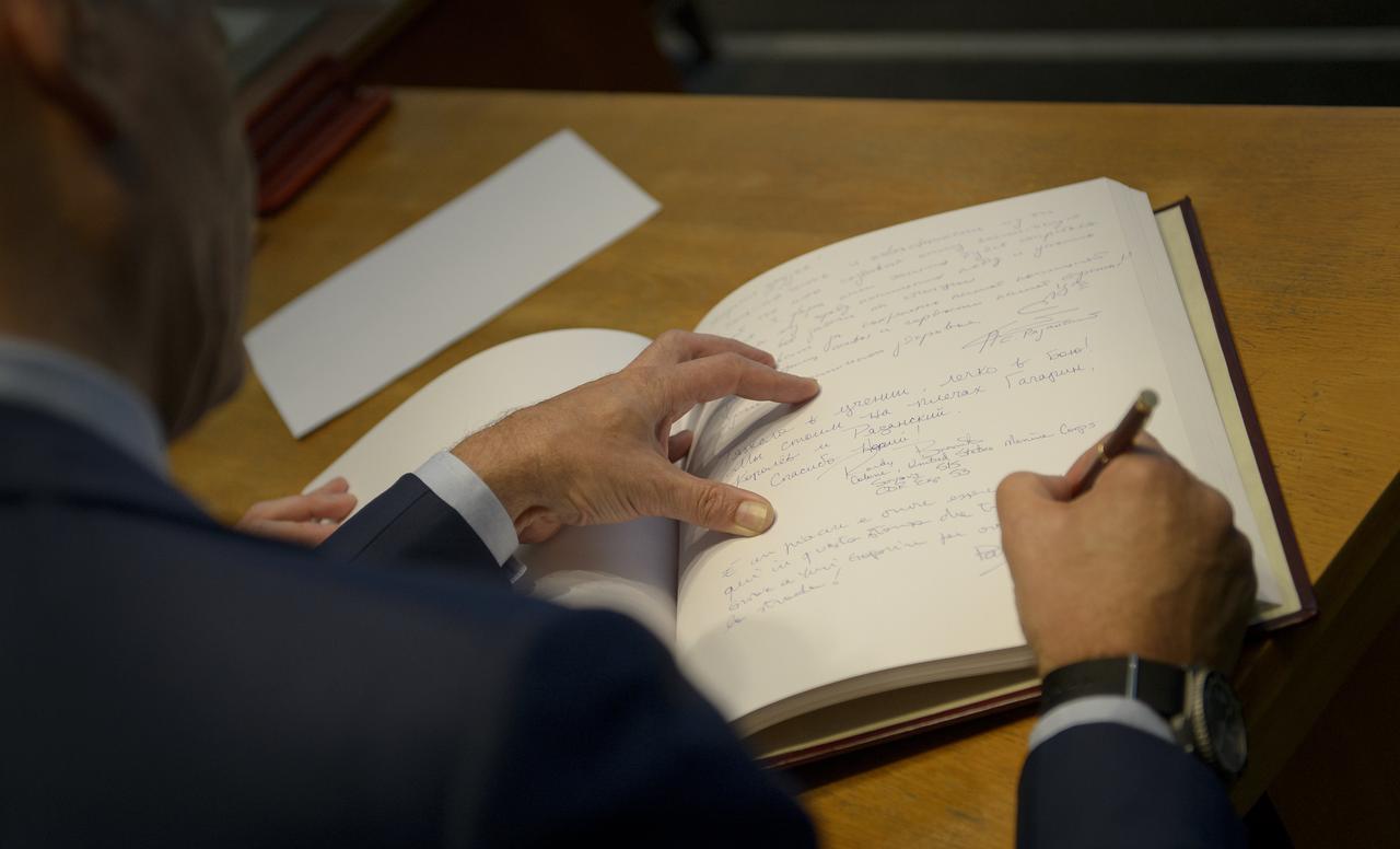 Expedition 52 flight engineer Paolo Nespoli of ESA signs a guest book at the "Memorial working study of Yuri Gagarin" at the Gagarin Cosmonaut Training Center (GCTC), Monday, July 10, 2017 in Star City, Russia. The memorial study represents Gagarin's working study in the way it was abandoned by Gagarin on March 27, 1968 before leaving for the airfield for training flight that became his last. Photo Credit: (NASA/Bill Ingalls)