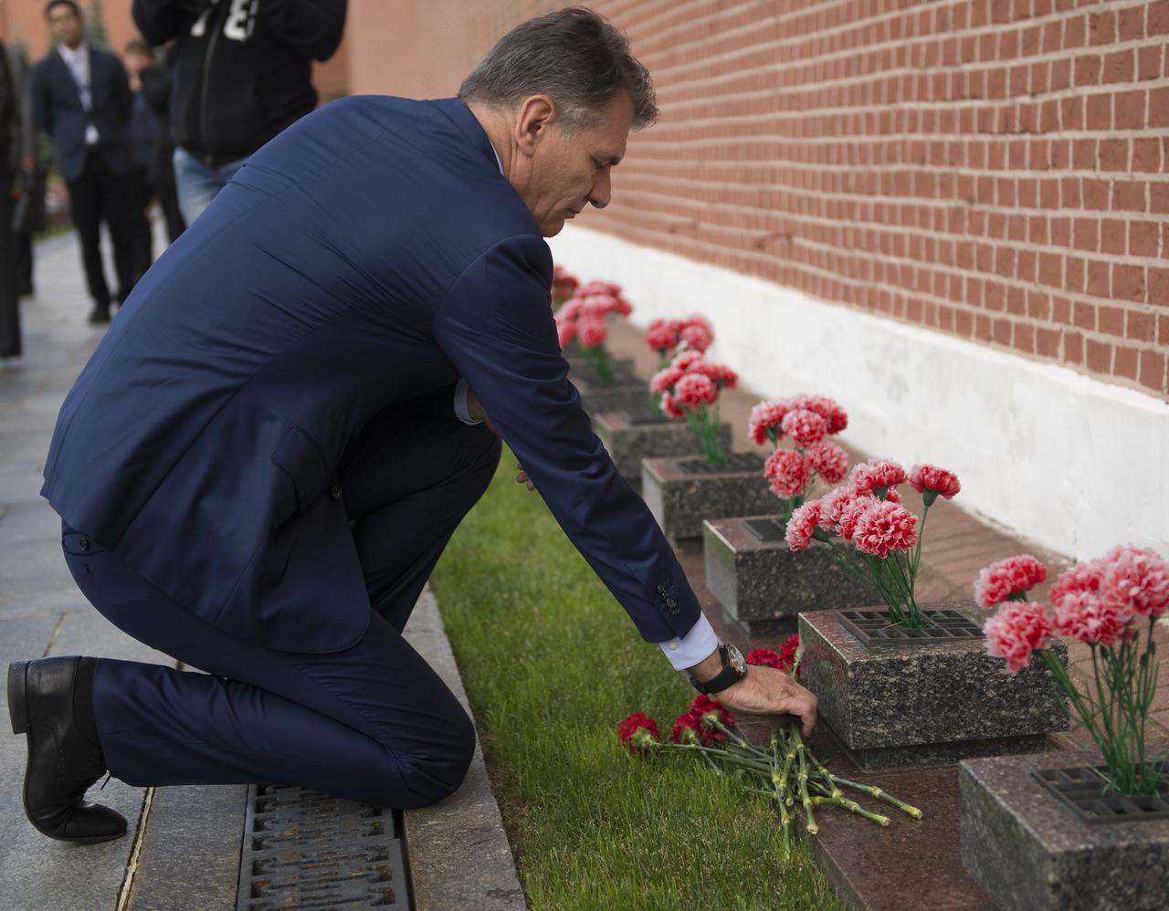 Expedition 52 flight engineer Paolo Nespoli of ESA lays roses at the site where Russian space icons are interred as part of traditional pre-launch ceremonies, Monday, July 10, 2017 in Moscow. Photo Credit: (NASA/Bill Ingalls)
