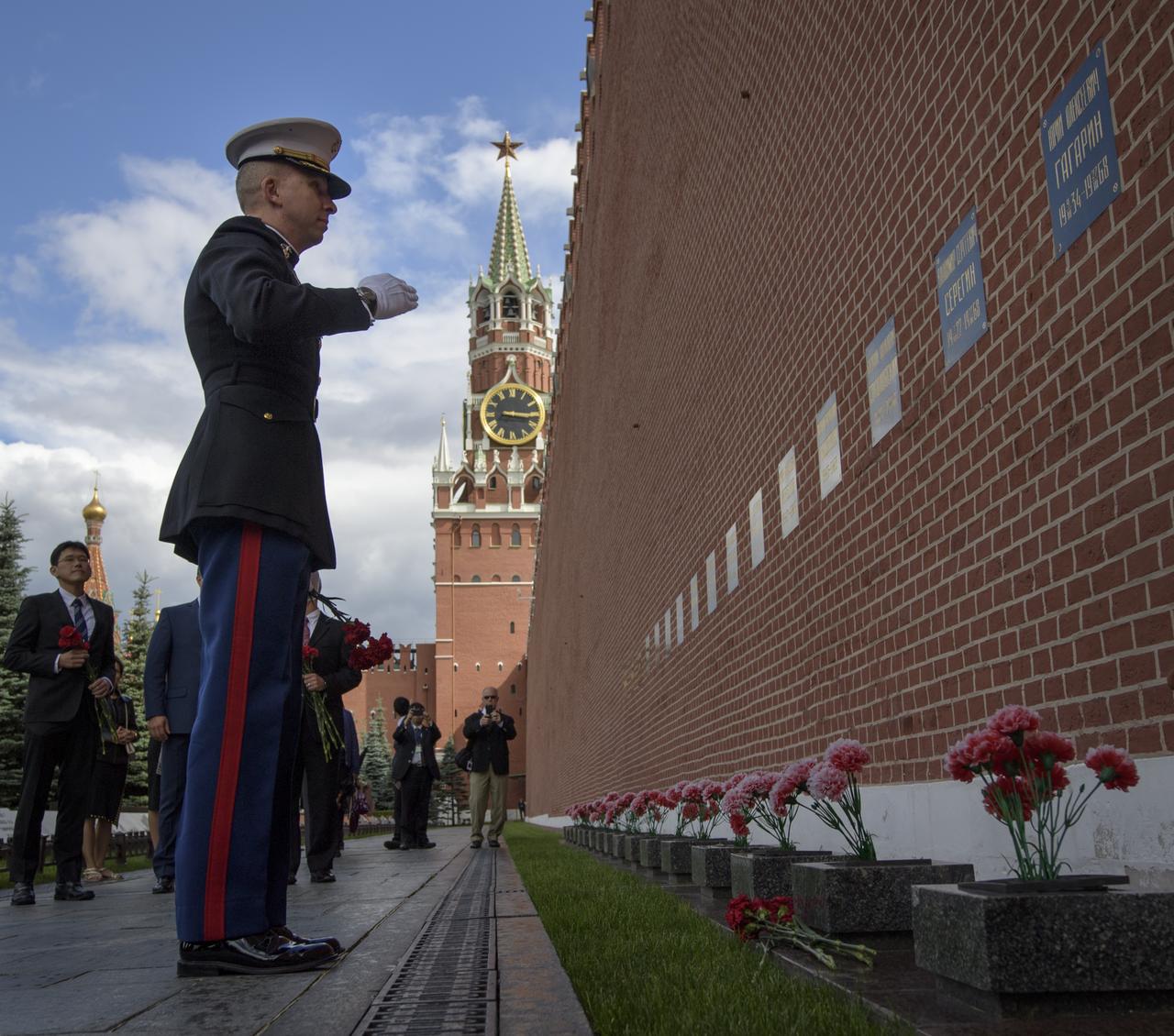 Expedition 52 flight engineer Randy Bresnik of NASA salutes after laying roses at the site where Russian space icons are interred as part of traditional pre-launch ceremonies, Monday, July 10, 2017 in Moscow. Photo Credit: (NASA/Bill Ingalls)