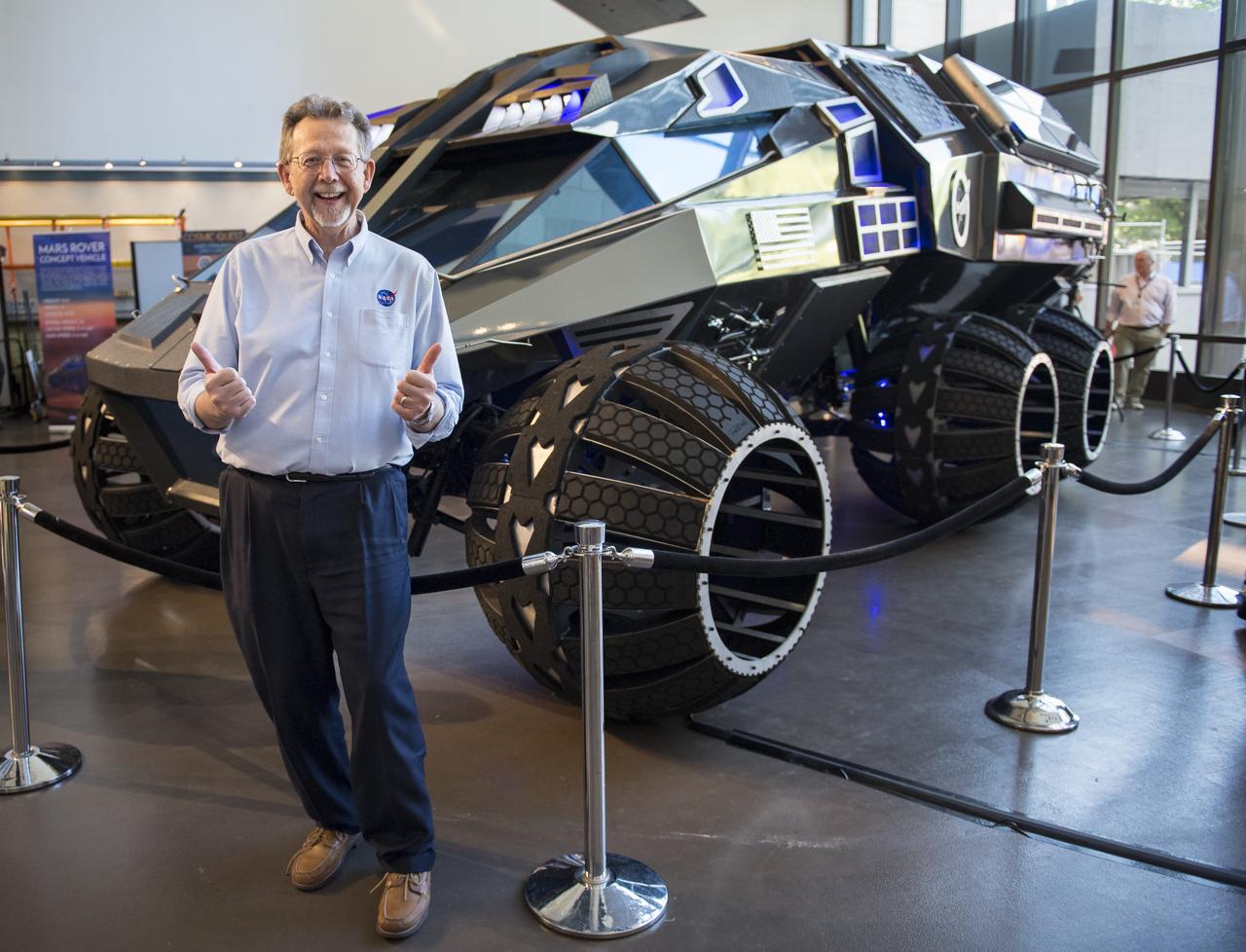 Jim Green, director of NASA’s Planetary Science Division, poses for a photo with the Mars rover concept, developed by vehicle designers, the Parker Brothers, with advice from NASA, during the Smithsonian Institution’s National Air and Space Museum’s Mars Day, Friday, July 21, 2017 in Washington. The Mars rover concept is currently on an East Coast tour from its home base at the Kennedy Space Center Visitor’s Center in Florida, and is designed to engage and educate the public by demonstrating the types of features and equipment a future human exploration vehicle may need. Photo Credit: (NASA/Aubrey Gemignani)