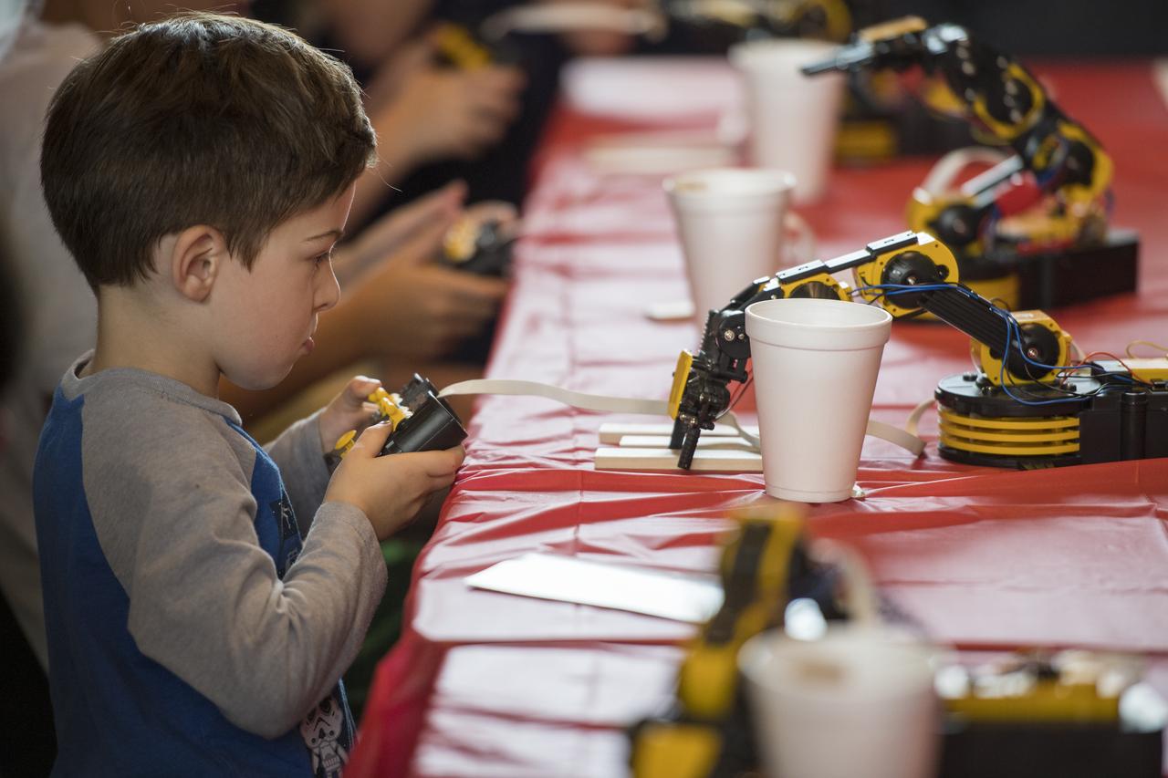 Visitors operate robotic arms at the Smithsonian Institution’s National Air and Space Museum Mars Day, an annual event celebrating the Red Planet with exhibits, speakers, and educational activities, Friday, July 21, 2017 in Washington. Photo Credit: (NASA/Aubrey Gemignani)