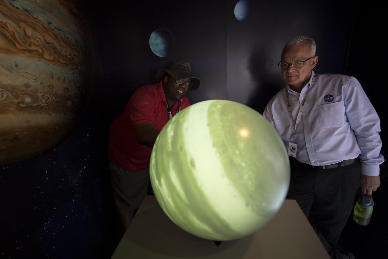 NASA Research Specialist Michael Brandon, left, demonstrates a visualization tool to NASA Acting Chief Technologist Douglas Terrier during the Boy Scouts of America National Jamboree, Tuesday, July 25, 2017 at the Summit Bechtel Reserve in Glen Jean, West Virginia. Photo Credit: (NASA/Bill Ingalls)