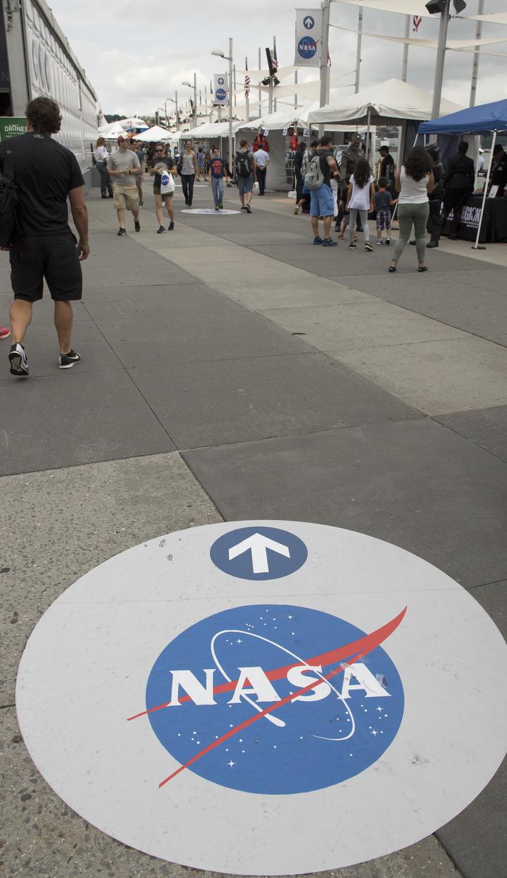 Signage points the way to NASA exhibits at the Intrepid Space & Science Festival, Saturday, Aug. 5, 2017 held at the Intrepid Sea, Air & Space Museum in New York City. The week-long festival featured talks, films and cutting-edge displays showcasing NASA technology. Photo Credit: (NASA/Bill Ingalls)