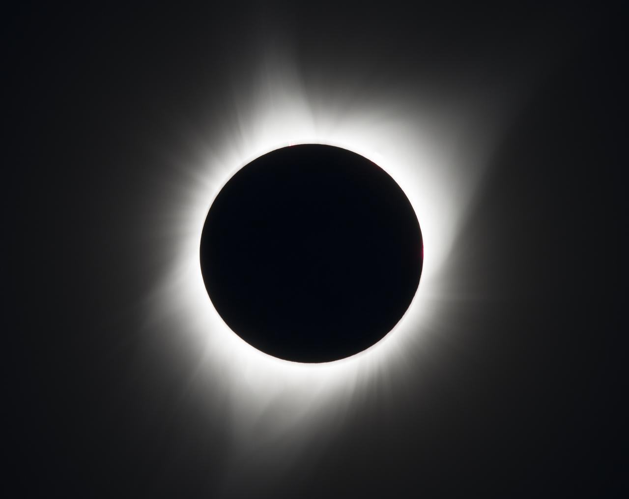 A total solar eclipse is seen on Monday, August 21, 2017 above Madras, Oregon. A total solar eclipse swept across a narrow portion of the contiguous United States from Lincoln Beach, Oregon to Charleston, South Carolina. A partial solar eclipse was visible across the entire North American continent along with parts of South America, Africa, and Europe.  Photo Credit: (NASA/Aubrey Gemignani)