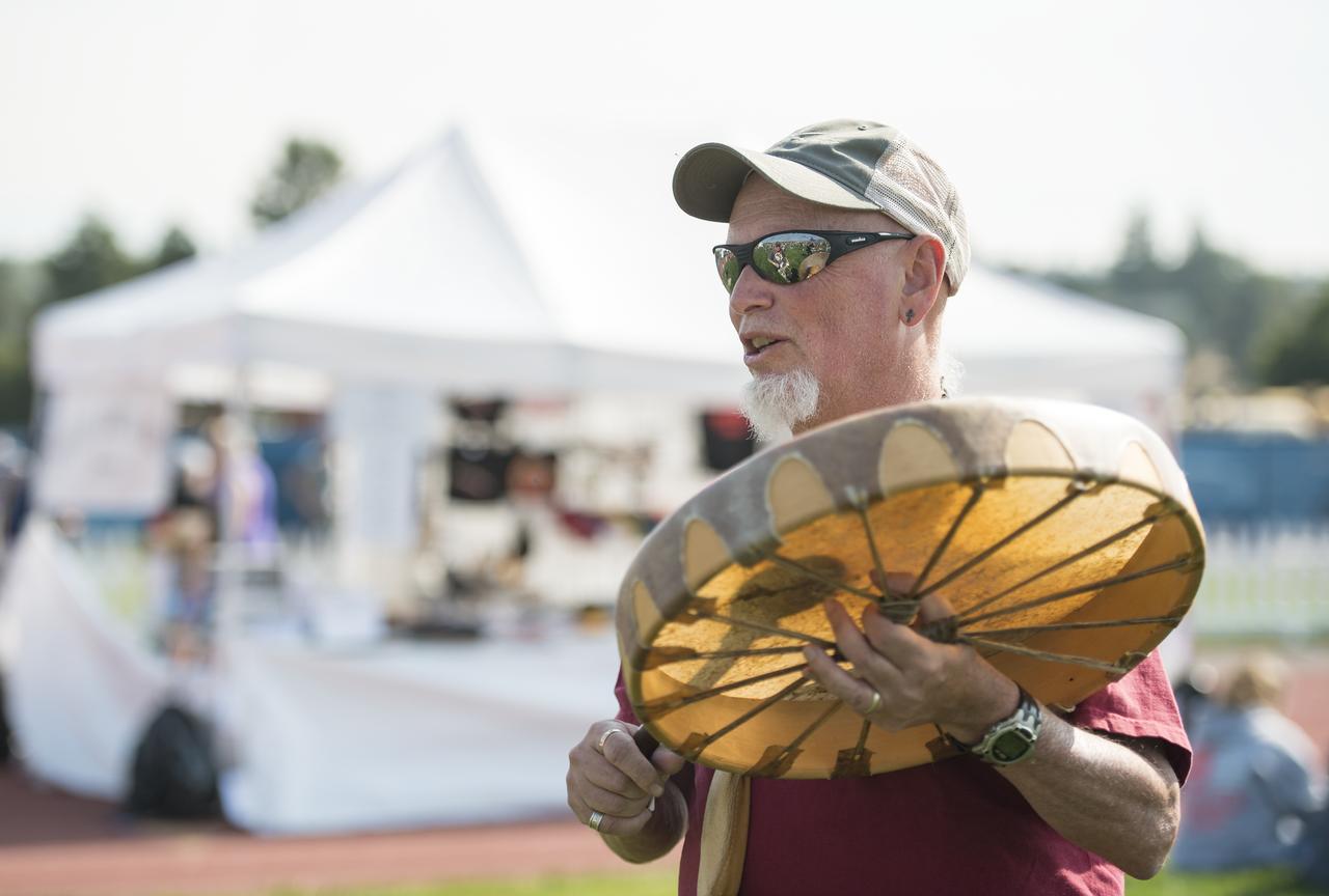A man drums during the partial phase of the total solar eclipse in Madras, Oregon on Monday, Aug. 21, 2017. A total solar eclipse swept across a narrow portion of the contiguous United States from Lincoln Beach, Oregon to Charleston, South Carolina. A partial solar eclipse was visible across the entire North American continent along with parts of South America, Africa, and Europe.  Photo Credit: (NASA/Aubrey Gemignani)