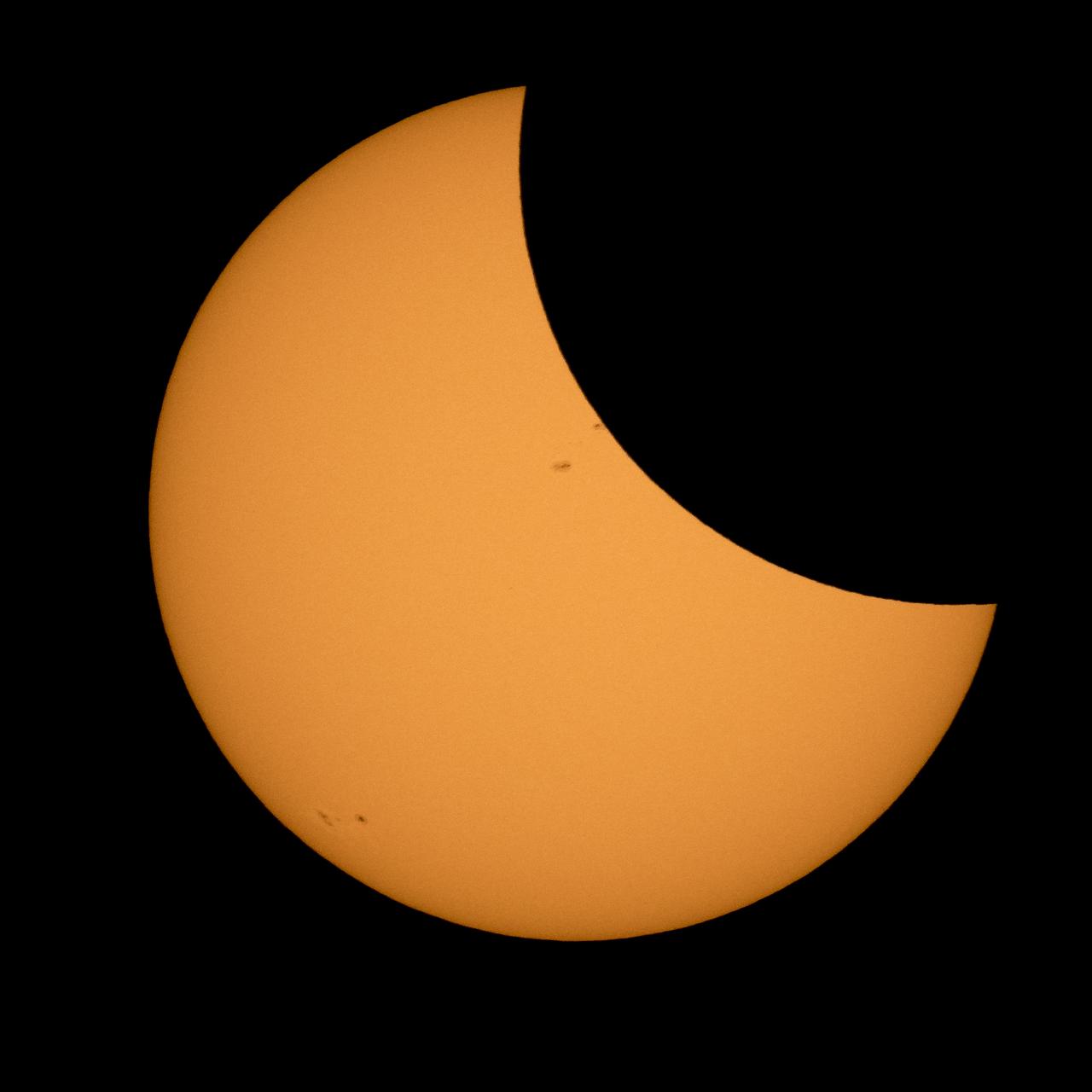 The Moon is seen passing in front of the Sun during a solar eclipse from Ross Lake, Northern Cascades National Park, Washington on Monday, Aug. 21, 2017. A total solar eclipse swept across a narrow portion of the contiguous United States from Lincoln Beach, Oregon to Charleston, South Carolina. A partial solar eclipse was visible across the entire North American continent along with parts of South America, Africa, and Europe.  Photo Credit: (NASA/Bill Ingalls)
