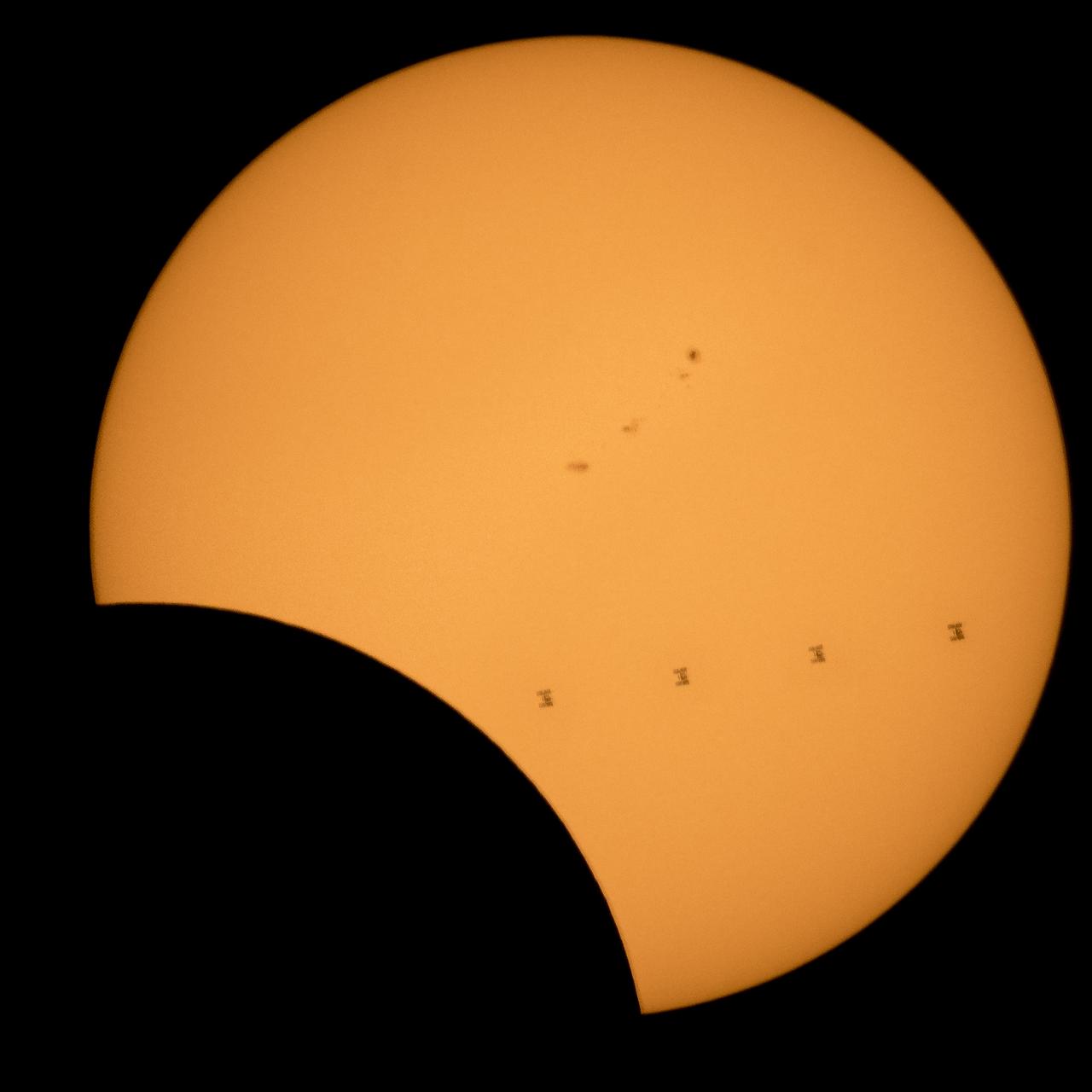 This composite image, made from 4 frames, shows the International Space Station, with a crew of six onboard, as it transits the Sun at roughly five miles per second during a partial solar eclipse, Monday, Aug. 21, 2017 from , Northern Cascades National Park in Washington. Onboard as part of Expedition 52 are: NASA astronauts Peggy Whitson, Jack Fischer, and Randy Bresnik; Russian cosmonauts Fyodor Yurchikhin and Sergey Ryazanskiy; and ESA (European Space Agency) astronaut Paolo Nespoli. A total solar eclipse swept across a narrow portion of the contiguous United States from Lincoln Beach, Oregon to Charleston, South Carolina. A partial solar eclipse was visible across the entire North American continent along with parts of South America, Africa, and Europe.  Photo Credit: (NASA/Bill Ingalls)