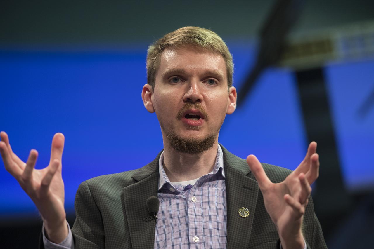 Eric Zirnstein, researcher, Princeton University, speaks at an event to celebrate the 40th Anniversary of the launch of the Voyager 1 and 2 missions, Tuesday, September 5, 2017 at Smithsonian's National Air and Space Museum in Washington. Voyager 1 was launched September 5, 1977, with a mission to study Jupiter and Saturn, but now the twin Voyager spacecrafts are on a journey into interstellar space to search for the heliopause, a region never reached by any other spacecraft. Photo Credit: (NASA/Aubrey