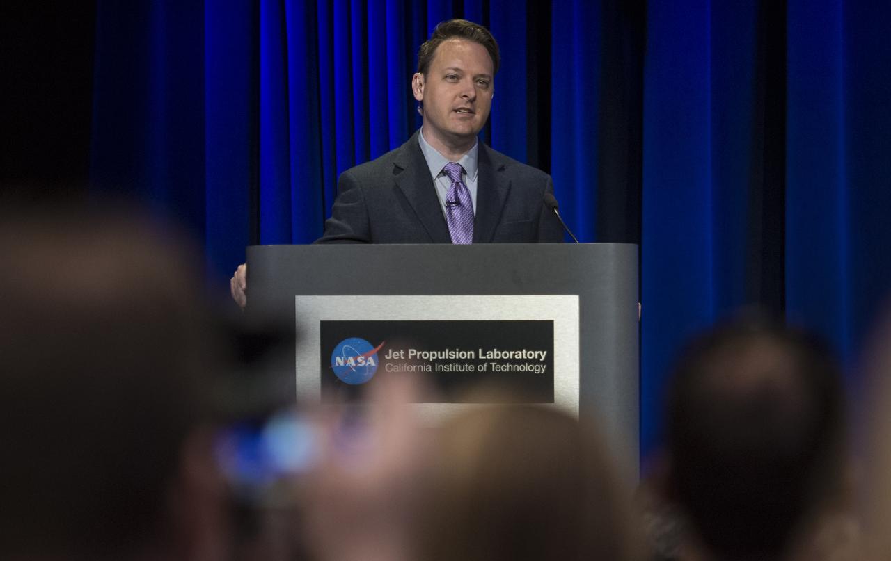 Preston Dyches, media relations specialist at NASA's Jet Propulsion Laboratory, during a press conference previewing Cassini's End of Mission, Wednesday, Sept. 13, 2017 at NASA's Jet Propulsion Laboratory in Pasadena, California. Since its arrival in 2004, the Cassini-Huygens mission has been a discovery machine, revolutionizing our knowledge of the Saturn system and captivating us with data and images never before obtained with such detail and clarity. On Sept. 15, 2017, operators will deliberately plunge the spacecraft into Saturn, as Cassini gathered science until the end. The “plunge” ensures Saturn’s moons will remain pristine for future exploration. During Cassini’s final days, mission team members from all around the world gathered at NASA’s Jet Propulsion Laboratory, Pasadena, California, to celebrate the achievements of this historic mission. Photo Credit: (NASA/Joel Kowsky)