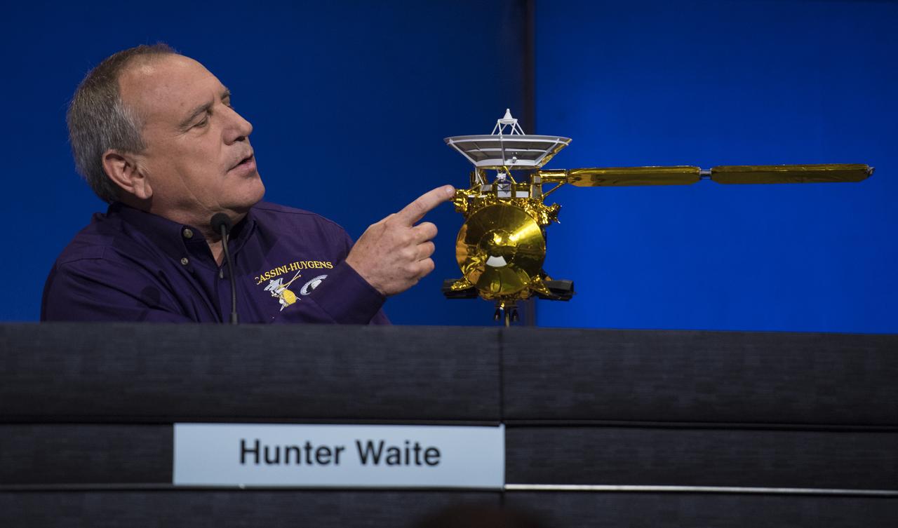 Principle investigator for the Ion and Neutral Mass Spectrometer (INMS) at the Southwest Research Institute, Hunter Waite, points to the location of the INMS during a press conference previewing Cassini's End of Mission, Wednesday, Sept. 13, 2017 at NASA's Jet Propulsion Laboratory in Pasadena, California. Since its arrival in 2004, the Cassini-Huygens mission has been a discovery machine, revolutionizing our knowledge of the Saturn system and captivating us with data and images never before obtained with such detail and clarity. On Sept. 15, 2017, operators will deliberately plunge the spacecraft into Saturn, as Cassini gathered science until the end. The “plunge” ensures Saturn’s moons will remain pristine for future exploration. During Cassini’s final days, mission team members from all around the world gathered at NASA’s Jet Propulsion Laboratory, Pasadena, California, to celebrate the achievements of this historic mission. Photo Credit: (NASA/Joel Kowsky)