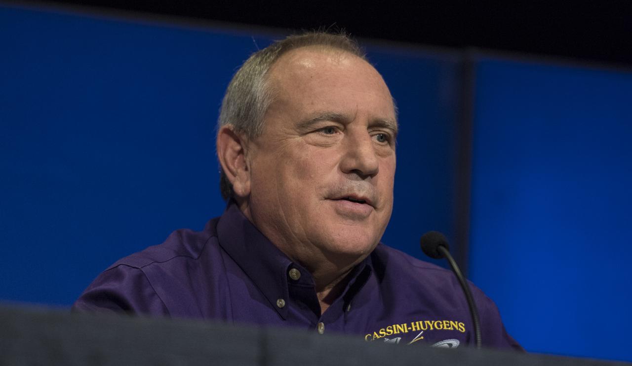 Principle investigator for the Neutral Mass Spectrometer (INMS) at the Southwest Research Institute, Hunter Waites, peaks during a press conference previewing Cassini's End of Mission, Wednesday, Sept. 13, 2017 at NASA's Jet Propulsion Laboratory in Pasadena, California. Since its arrival in 2004, the Cassini-Huygens mission has been a discovery machine, revolutionizing our knowledge of the Saturn system and captivating us with data and images never before obtained with such detail and clarity. On Sept. 15, 2017, operators will deliberately plunge the spacecraft into Saturn, as Cassini gathered science until the end. The “plunge” ensures Saturn’s moons will remain pristine for future exploration. During Cassini’s final days, mission team members from all around the world gathered at NASA’s Jet Propulsion Laboratory, Pasadena, California, to celebrate the achievements of this historic mission. Photo Credit: (NASA/Joel Kowsky)