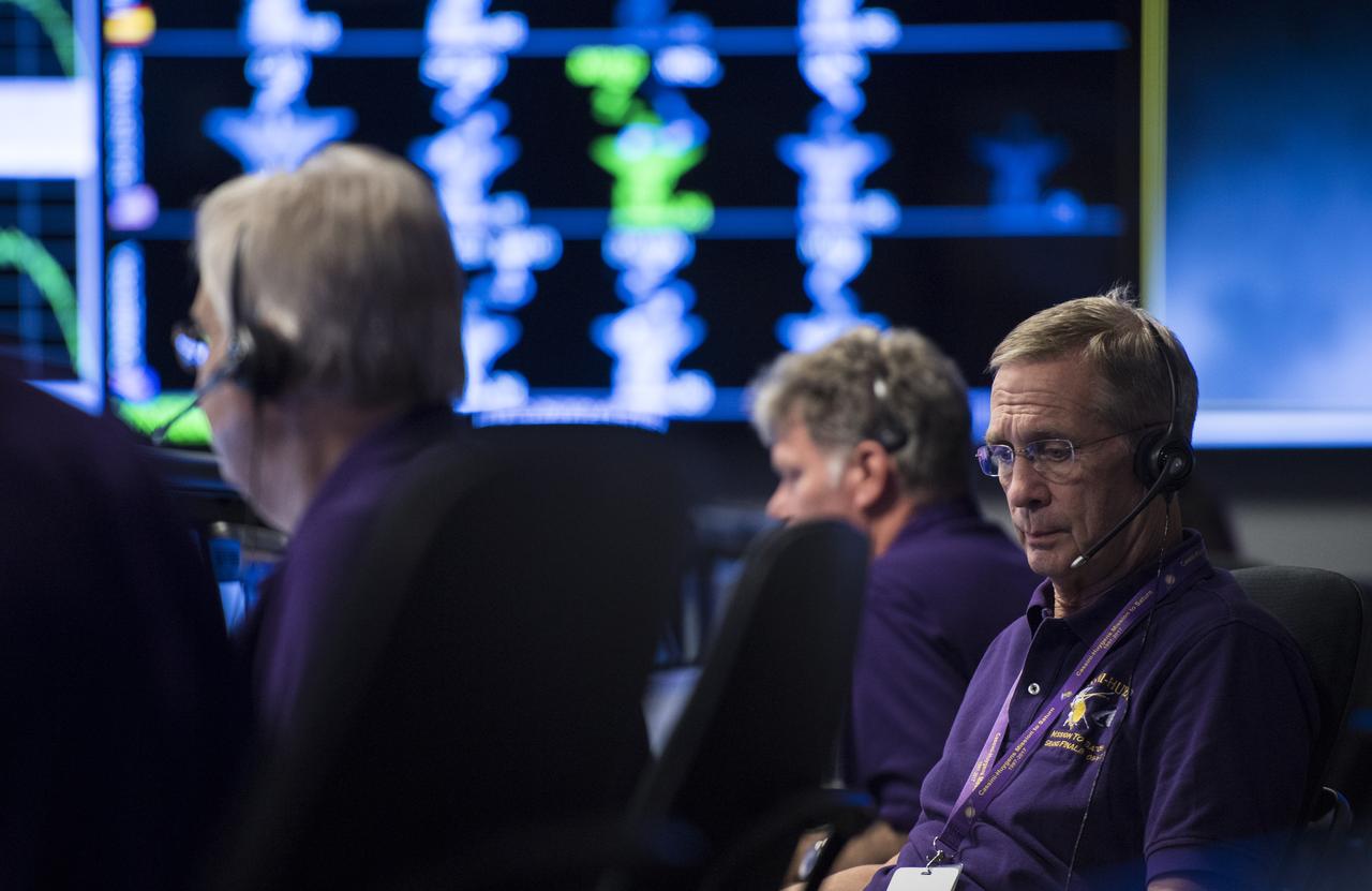 Cassini program manager at JPL, Earl Maize, is seen in mission control of the Space Flight Operations Center as the Cassini team wait for the spacecraft to establish a connection with NASA's Deep Space Network to begin the final playback of its data recorder, Thursday, Sept. 14, 2017 at NASA's Jet Propulsion Laboratory in Pasadena, California. Since its arrival in 2004, the Cassini-Huygens mission has been a discovery machine, revolutionizing our knowledge of the Saturn system and captivating us with data and images never before obtained with such detail and clarity. On Sept. 15, 2017, operators will deliberately plunge the spacecraft into Saturn, as Cassini gathered science until the end. The “plunge” ensures Saturn’s moons will remain pristine for future exploration. During Cassini’s final days, mission team members from all around the world gathered at NASA’s Jet Propulsion Laboratory, Pasadena, California, to celebrate the achievements of this historic mission. Photo Credit: (NASA/Joel Kowsky)