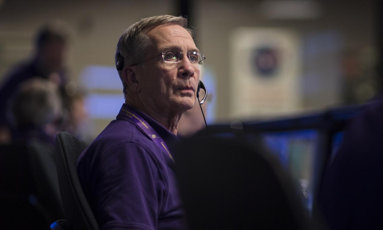 Cassini program manager at JPL, Earl Maize, watches monitors in mission control of the Space Flight Operations Center as the Cassini spacecraft begins downlink data through NASA's Deep Space Network, Thursday, Sept. 14, 2017 at NASA's Jet Propulsion Laboratory in Pasadena, California. Since its arrival in 2004, the Cassini-Huygens mission has been a discovery machine, revolutionizing our knowledge of the Saturn system and captivating us with data and images never before obtained with such detail and clarity. On Sept. 15, 2017, operators will deliberately plunge the spacecraft into Saturn, as Cassini gathered science until the end. The “plunge” ensures Saturn’s moons will remain pristine for future exploration. During Cassini’s final days, mission team members from all around the world gathered at NASA’s Jet Propulsion Laboratory, Pasadena, California, to celebrate the achievements of this historic mission. Photo Credit: (NASA/Joel Kowsky)