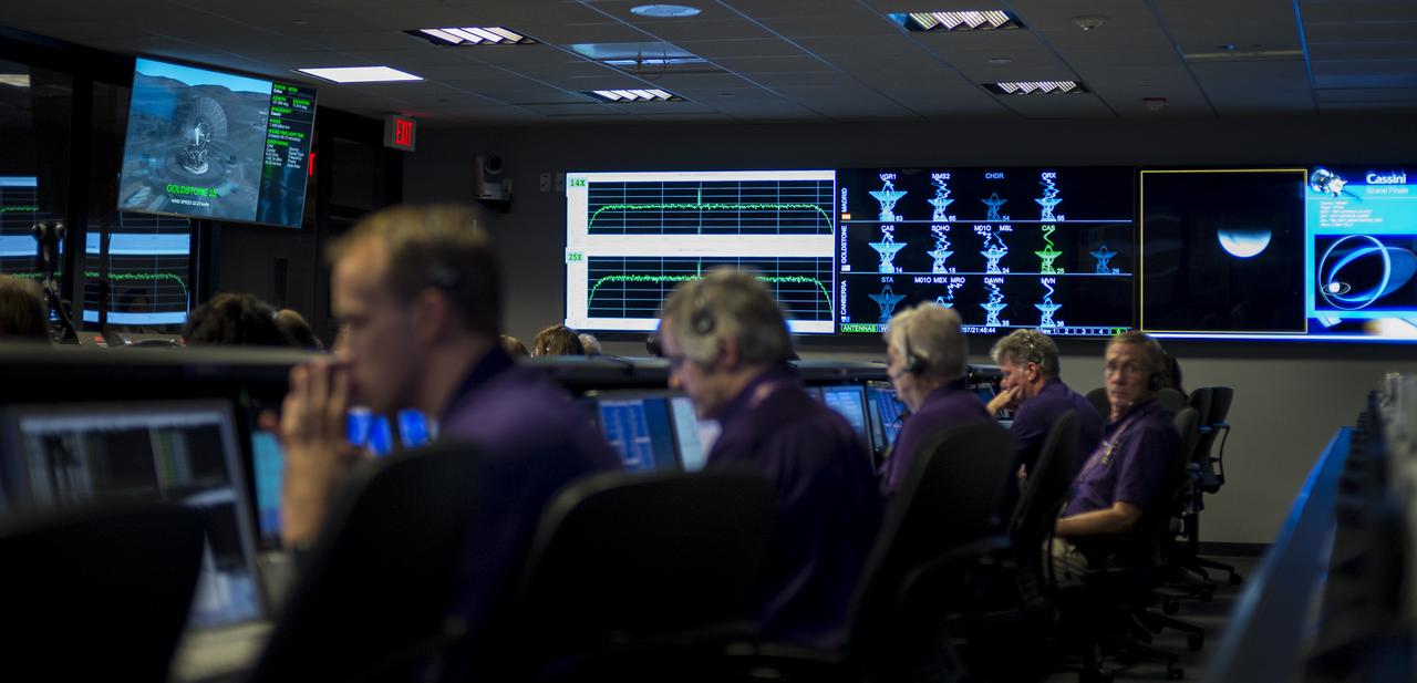 Monitors in mission control of the Space Flight Operations Center display the status of NASA's Deep Space Network as the Cassini spacecraft begins the final playback of its data recorder, Thursday, Sept. 14, 2017 at NASA's Jet Propulsion Laboratory in Pasadena, California. Since its arrival in 2004, the Cassini-Huygens mission has been a discovery machine, revolutionizing our knowledge of the Saturn system and captivating us with data and images never before obtained with such detail and clarity. On Sept. 15, 2017, operators will deliberately plunge the spacecraft into Saturn, as Cassini gathered science until the end. The “plunge” ensures Saturn’s moons will remain pristine for future exploration. During Cassini’s final days, mission team members from all around the world gathered at NASA’s Jet Propulsion Laboratory, Pasadena, California, to celebrate the achievements of this historic mission. Photo Credit: (NASA/Joel Kowsky)