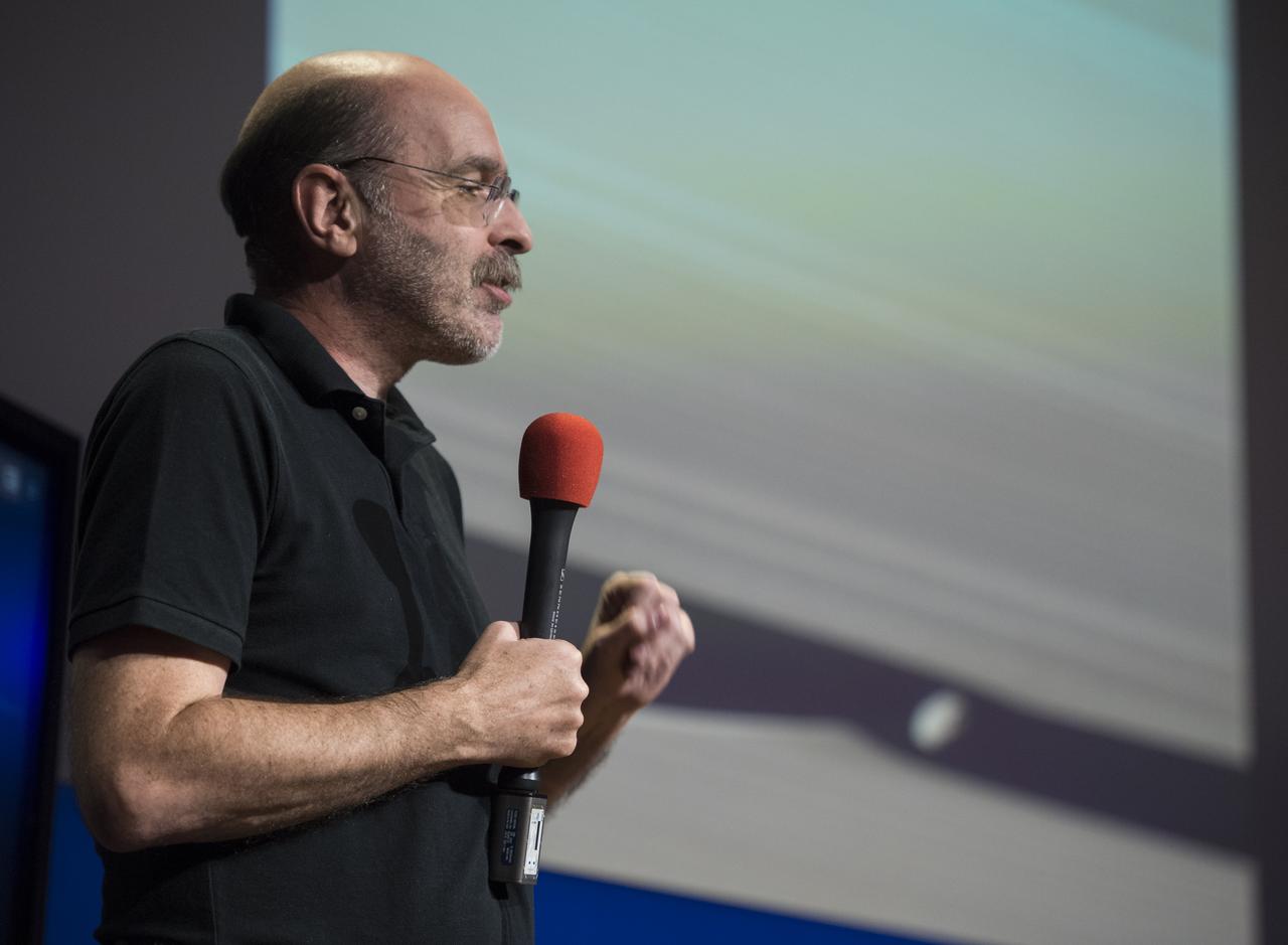 Cassini imaging science subsystem (ISS) team associate Mike Evans speaks with Cassini NASA Social attendees, Thursday, Sept. 14, 2017 at NASA's Jet Propulsion Laboratory in Pasadena, California. Since its arrival in 2004, the Cassini-Huygens mission has been a discovery machine, revolutionizing our knowledge of the Saturn system and captivating us with data and images never before obtained with such detail and clarity. On Sept. 15, 2017, operators will deliberately plunge the spacecraft into Saturn, as Cassini gathered science until the end. The “plunge” ensures Saturn’s moons will remain pristine for future exploration. During Cassini’s final days, mission team members from all around the world gathered at NASA’s Jet Propulsion Laboratory, Pasadena, California, to celebrate the achievements of this historic mission. Photo Credit: (NASA/Joel Kowsky)