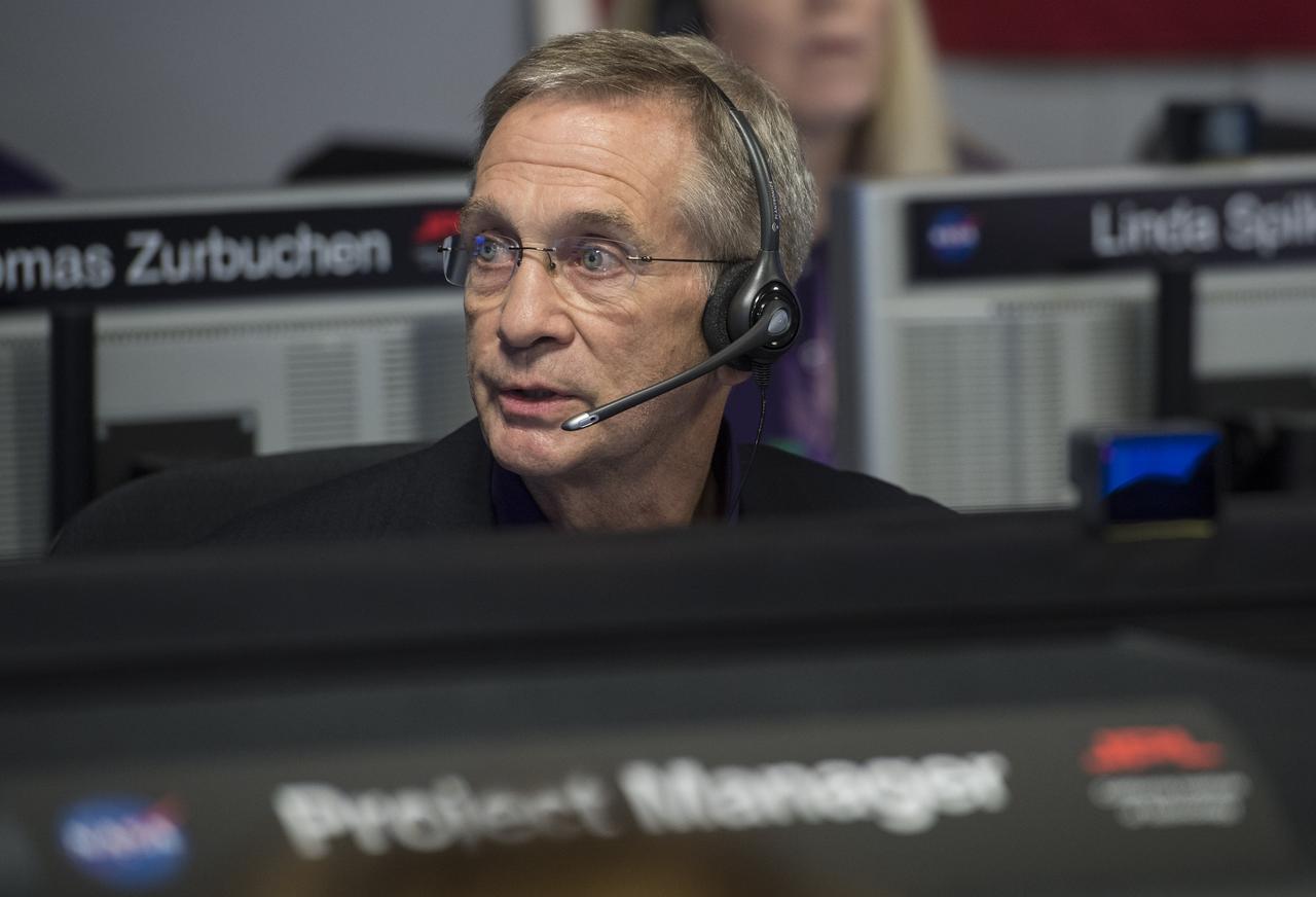 Cassini program manager at JPL, Earl Maize, center row, calls out the end of the Cassini mission, Friday, Sept. 15, 2017 at NASA's Jet Propulsion Laboratory in Pasadena, California. Since its arrival in 2004, the Cassini-Huygens mission has been a discovery machine, revolutionizing our knowledge of the Saturn system and captivating us with data and images never before obtained with such detail and clarity. On Sept. 15, 2017, operators deliberately plunged the spacecraft into Saturn, as Cassini gathered science until the end. The “plunge” ensures Saturn’s moons will remain pristine for future exploration. During Cassini’s final days, mission team members from all around the world gathered at NASA’s Jet Propulsion Laboratory, Pasadena, California, to celebrate the achievements of this historic mission. Photo Credit: (NASA/Joel Kowsky)