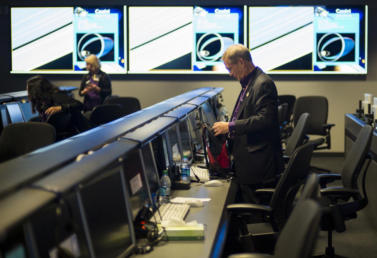 Cassini program manager at JPL, Earl Maize packs up his workspace in mission control after the end of the Cassini mission, Friday, Sept. 15, 2017 at NASA's Jet Propulsion Laboratory in Pasadena, California. Since its arrival in 2004, the Cassini-Huygens mission has been a discovery machine, revolutionizing our knowledge of the Saturn system and captivating us with data and images never before obtained with such detail and clarity. On Sept. 15, 2017, operators deliberately plunged the spacecraft into Saturn, as Cassini gathered science until the end. Loss of contact with the Cassini spacecraft occurred at 7:55 a.m. EDT (4:55 a.m. PDT). The “plunge” ensures Saturn’s moons will remain pristine for future exploration. During Cassini’s final days, mission team members from all around the world gathered at NASA’s Jet Propulsion Laboratory, Pasadena, California, to celebrate the achievements of this historic mission. Photo Credit: (NASA/Joel Kowsky)