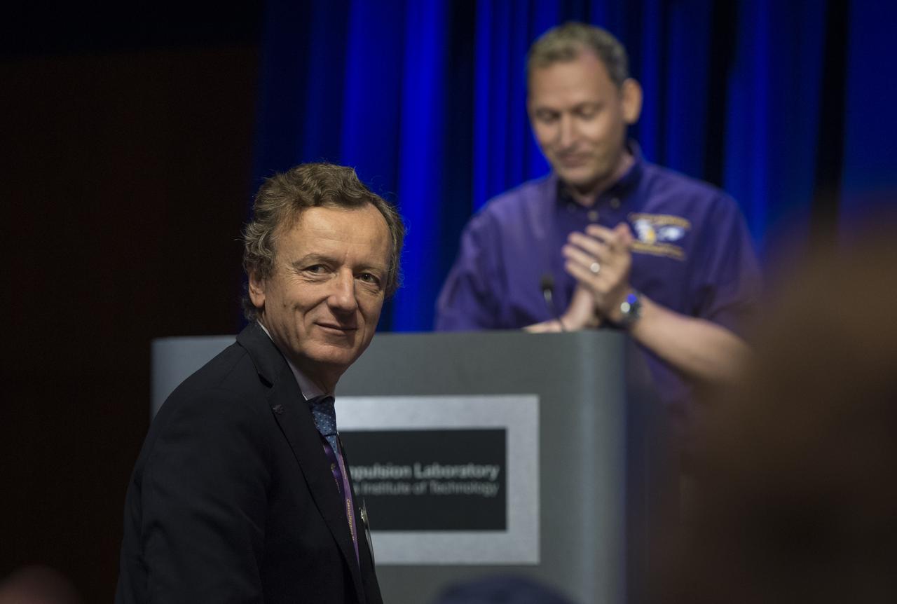 Italian Space Agency (ASI) representative, Enrico Flamini, is introduced during a press conference held after the end of the Cassini mission, Friday, Sept. 15, 2017 at NASA's Jet Propulsion Laboratory in Pasadena, California. Since its arrival in 2004, the Cassini-Huygens mission has been a discovery machine, revolutionizing our knowledge of the Saturn system and captivating us with data and images never before obtained with such detail and clarity. On Sept. 15, 2017, operators deliberately plunged the spacecraft into Saturn, as Cassini gathered science until the end. Loss of contact with the Cassini spacecraft occurred at 7:55 a.m. EDT (4:55 a.m. PDT). The “plunge” ensures Saturn’s moons will remain pristine for future exploration. During Cassini’s final days, mission team members from all around the world gathered at NASA’s Jet Propulsion Laboratory, Pasadena, California, to celebrate the achievements of this historic mission. Photo Credit: (NASA/Joel Kowsky)