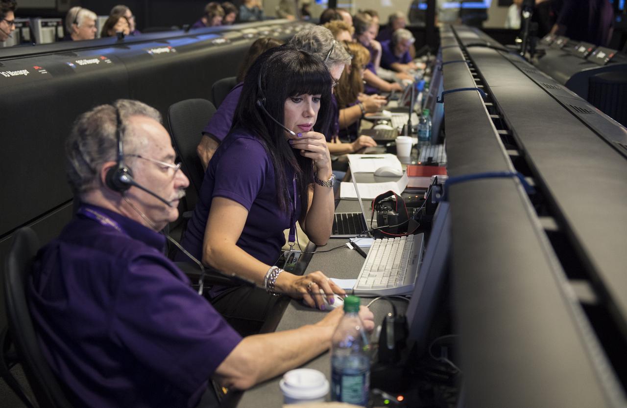 Aseel Anabtawi, of Cassini's radio science team, monitors her console in mission control during Cassini's final plunge into Saturn, Friday, Sept. 15, 2017 at NASA's Jet Propulsion Laboratory in Pasadena, California. Since its arrival in 2004, the Cassini-Huygens mission has been a discovery machine, revolutionizing our knowledge of the Saturn system and captivating us with data and images never before obtained with such detail and clarity. On Sept. 15, 2017, operators deliberately plunged the spacecraft into Saturn, as Cassini gathered science until the end. Loss of contact with the Cassini spacecraft occurred at 7:55 a.m. EDT (4:55 a.m. PDT). The “plunge” ensures Saturn’s moons will remain pristine for future exploration. During Cassini’s final days, mission team members from all around the world gathered at NASA’s Jet Propulsion Laboratory, Pasadena, California, to celebrate the achievements of this historic mission. Photo Credit: (NASA/Joel Kowsky)