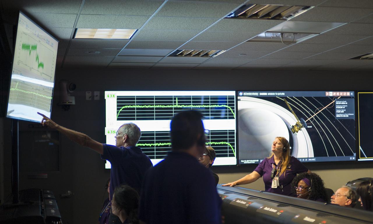 Cassini team members monitor data from the spacecraft as it makes its final plunge into Saturn, Friday, Sept. 15, 2017 at NASA's Jet Propulsion Laboratory in Pasadena, California. Since its arrival in 2004, the Cassini-Huygens mission has been a discovery machine, revolutionizing our knowledge of the Saturn system and captivating us with data and images never before obtained with such detail and clarity. On Sept. 15, 2017, operators deliberately plunged the spacecraft into Saturn, as Cassini gathered science until the end. Loss of contact with the Cassini spacecraft occurred at 7:55 a.m. EDT (4:55 a.m. PDT). The “plunge” ensures Saturn’s moons will remain pristine for future exploration. During Cassini’s final days, mission team members from all around the world gathered at NASA’s Jet Propulsion Laboratory, Pasadena, California, to celebrate the achievements of this historic mission. Photo Credit: (NASA/Joel Kowsky)