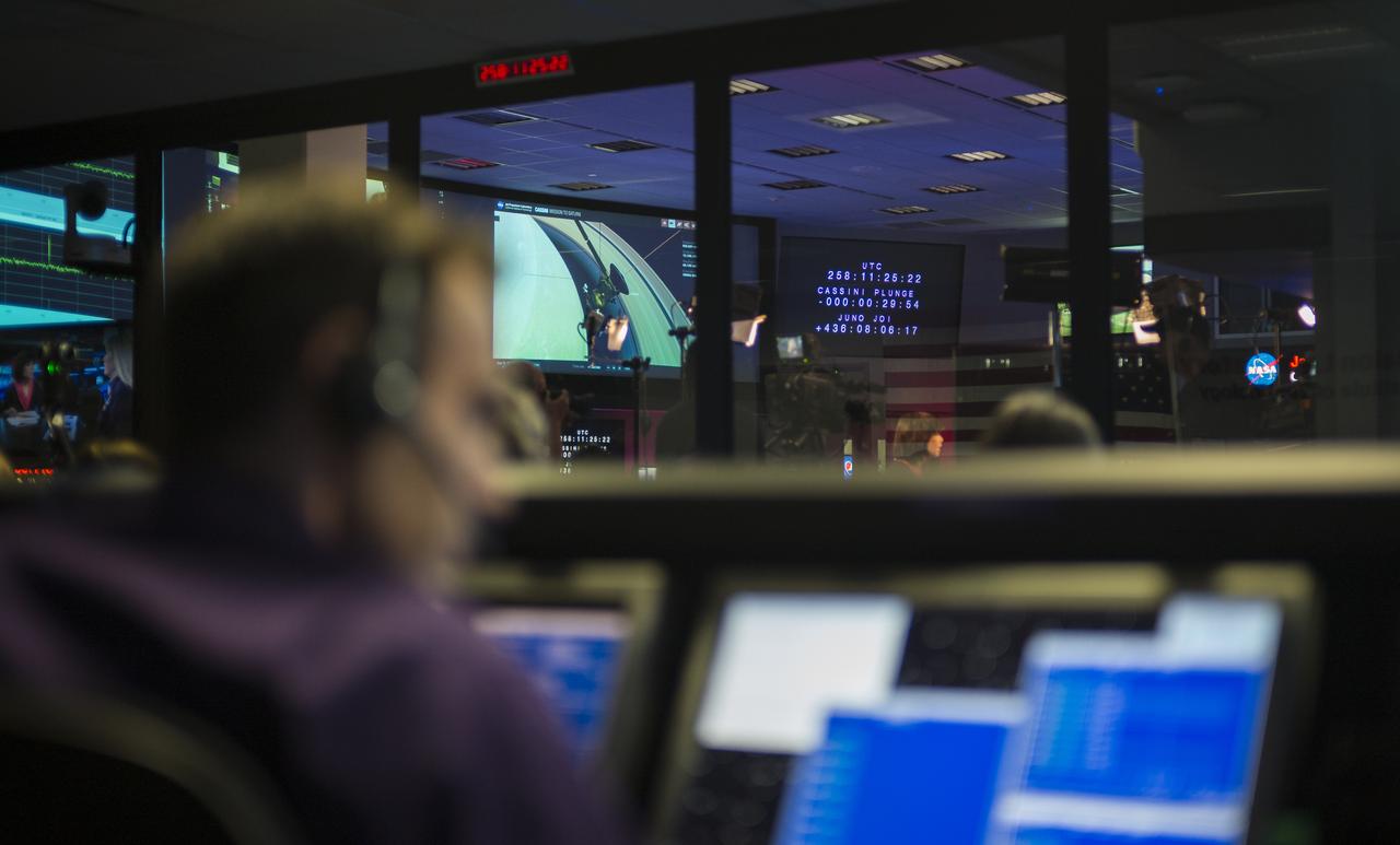 A monitor in mission control shows the time remaining until Cassini makes its final plunge into Saturn, Friday, Sept. 15, 2017 at NASA's Jet Propulsion Laboratory in Pasadena, California. Since its arrival in 2004, the Cassini-Huygens mission has been a discovery machine, revolutionizing our knowledge of the Saturn system and captivating us with data and images never before obtained with such detail and clarity. On Sept. 15, 2017, operators deliberately plunged the spacecraft into Saturn, as Cassini gathered science until the end. Loss of contact with the Cassini spacecraft occurred at 7:55 a.m. EDT (4:55 a.m. PDT). The “plunge” ensures Saturn’s moons will remain pristine for future exploration. During Cassini’s final days, mission team members from all around the world gathered at NASA’s Jet Propulsion Laboratory, Pasadena, California, to celebrate the achievements of this historic mission. Photo Credit: (NASA/Joel Kowsky)