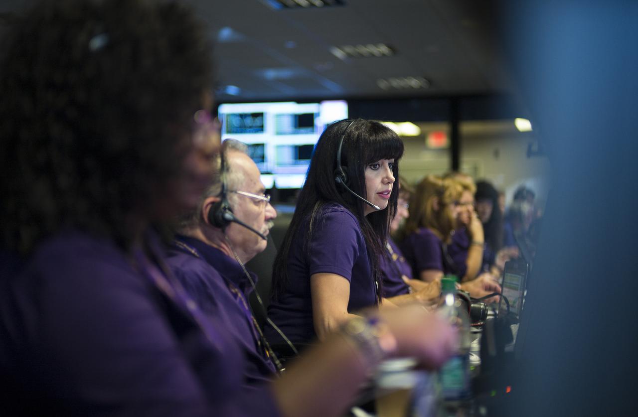 Aseel Anabtawi, of Cassini's radio science team, monitors her console in mission control during Cassini's final plunge into Saturn, Friday, Sept. 15, 2017 at NASA's Jet Propulsion Laboratory in Pasadena, California. Since its arrival in 2004, the Cassini-Huygens mission has been a discovery machine, revolutionizing our knowledge of the Saturn system and captivating us with data and images never before obtained with such detail and clarity. On Sept. 15, 2017, operators deliberately plunged the spacecraft into Saturn, as Cassini gathered science until the end. Loss of contact with the Cassini spacecraft occurred at 7:55 a.m. EDT (4:55 a.m. PDT). The “plunge” ensures Saturn’s moons will remain pristine for future exploration. During Cassini’s final days, mission team members from all around the world gathered at NASA’s Jet Propulsion Laboratory, Pasadena, California, to celebrate the achievements of this historic mission. Photo Credit: (NASA/Joel Kowsky)